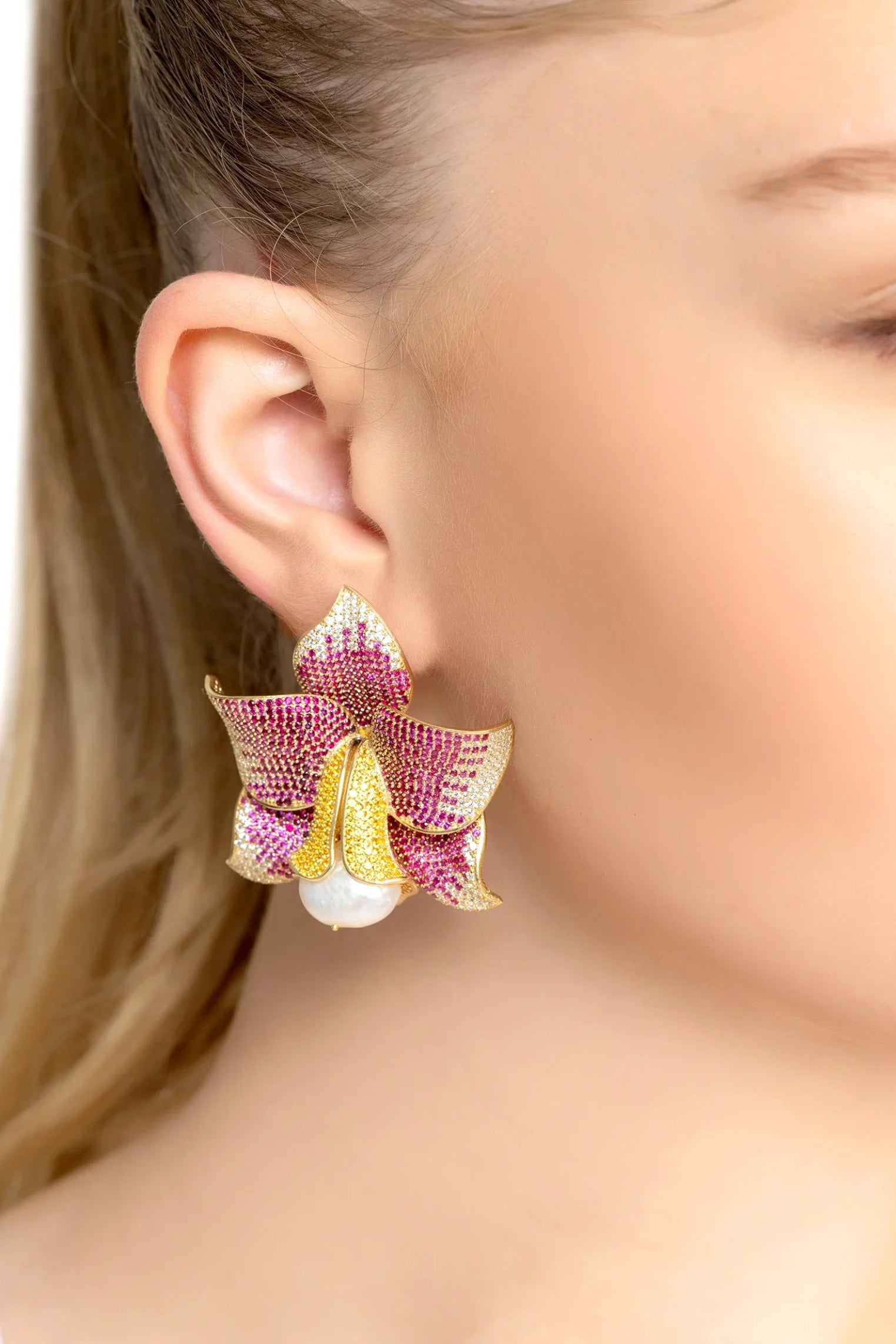 The earring worn by a model.