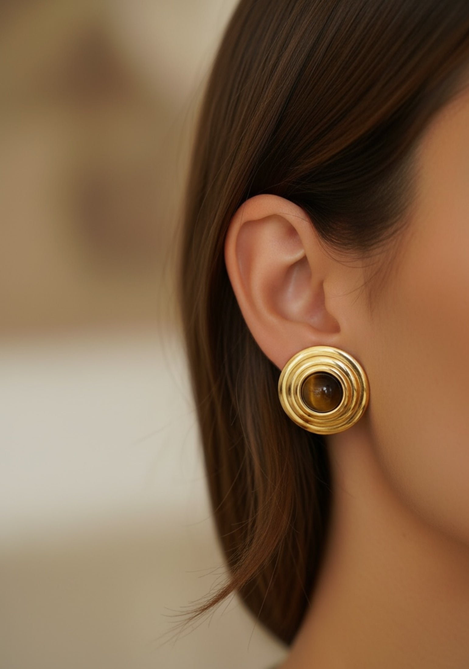 The earring worn by a model.