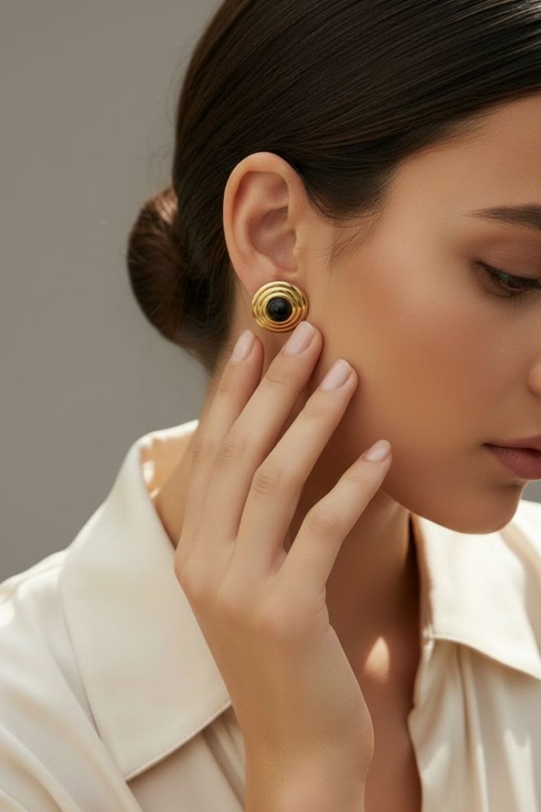 The earring worn by a model.
