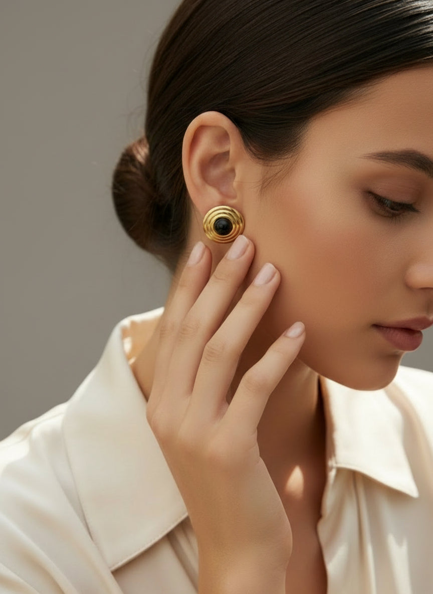 The earring worn by a model.