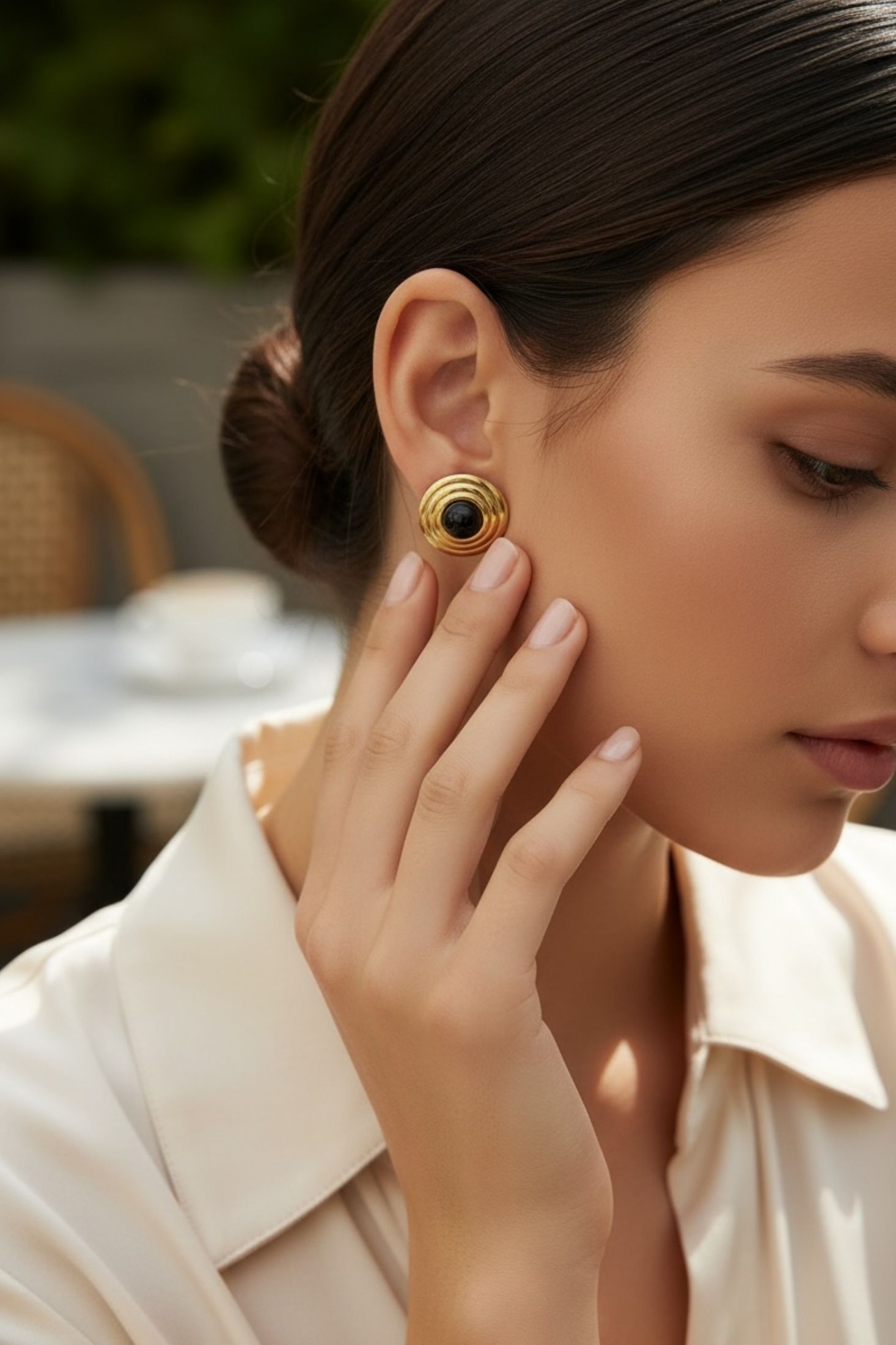 The earring worn by a model.