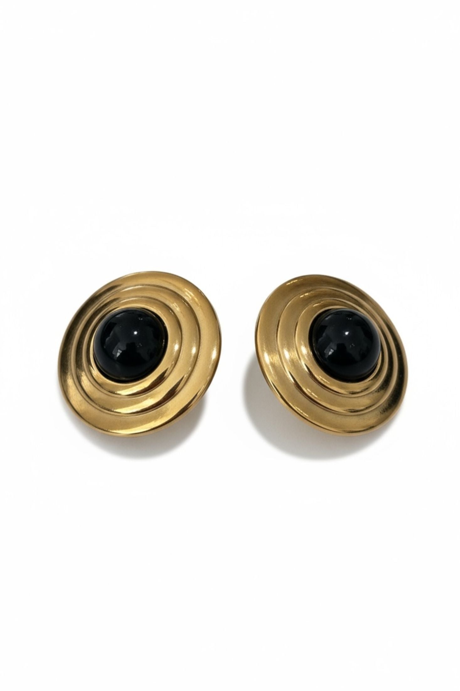 Gold and onyx stud earrings.