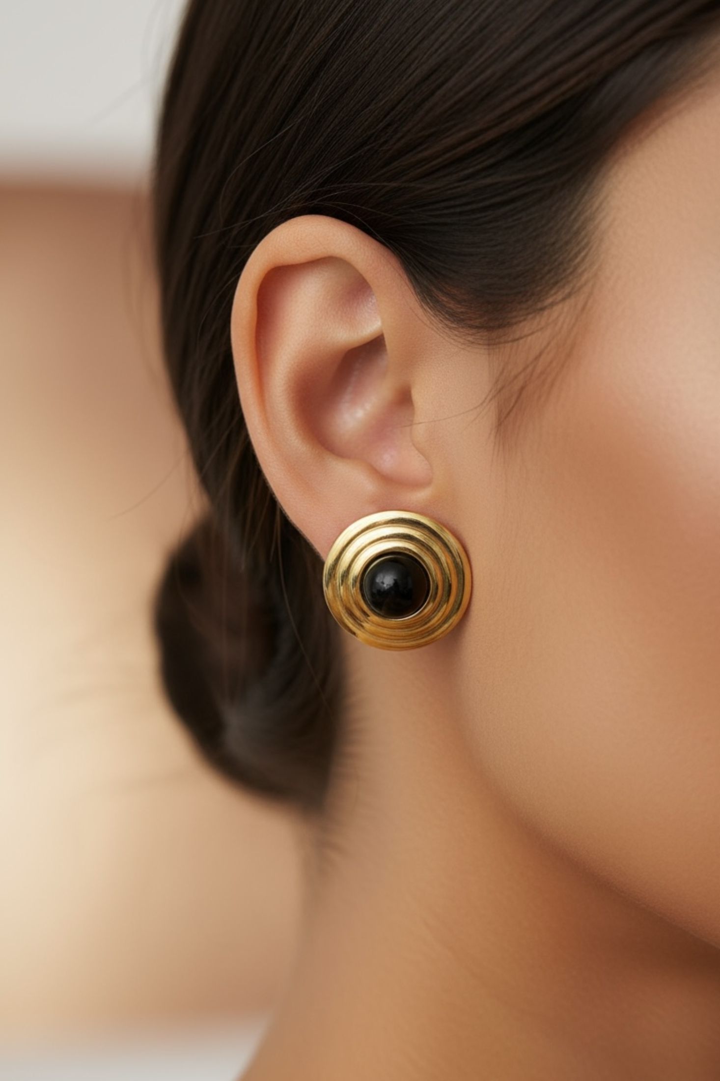 The earring worn by a model.