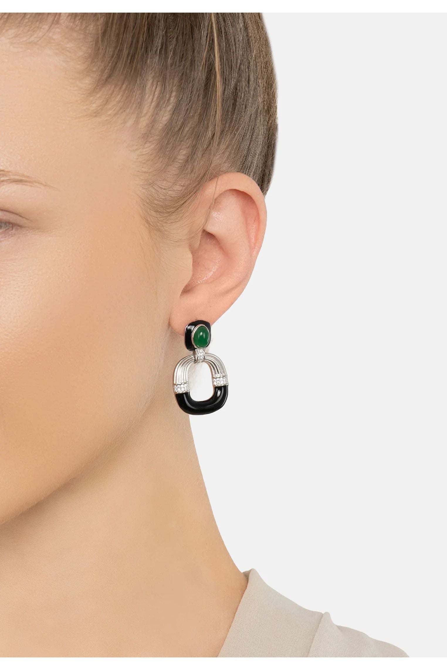 The earring worn by a model.