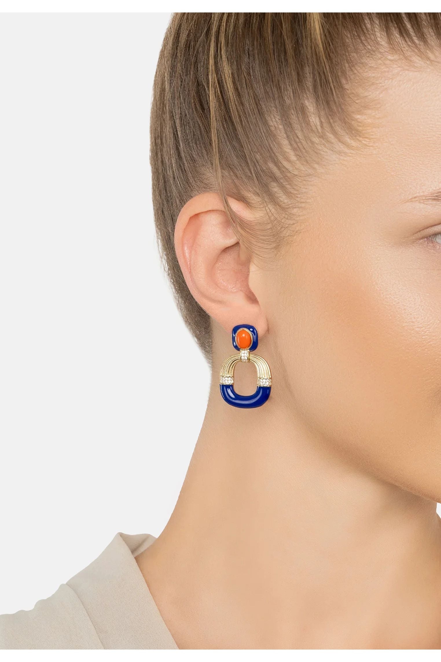 The earring worn by a model.