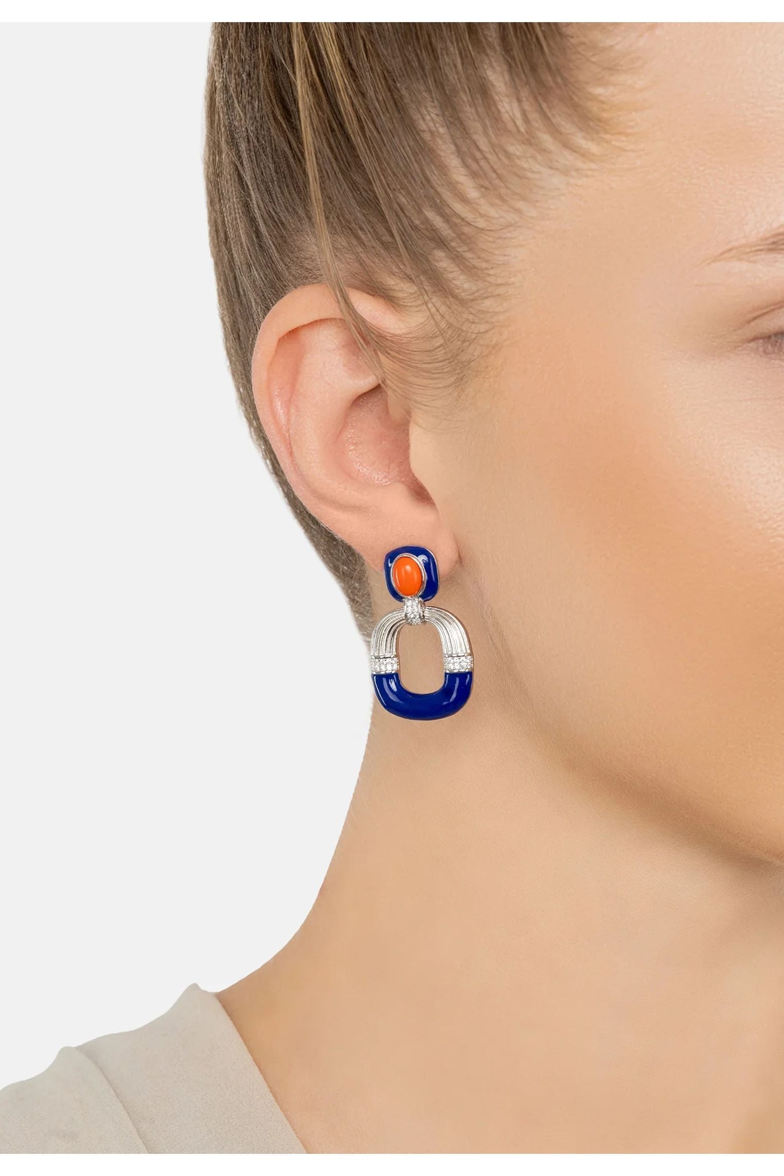 The earring worn by a model.