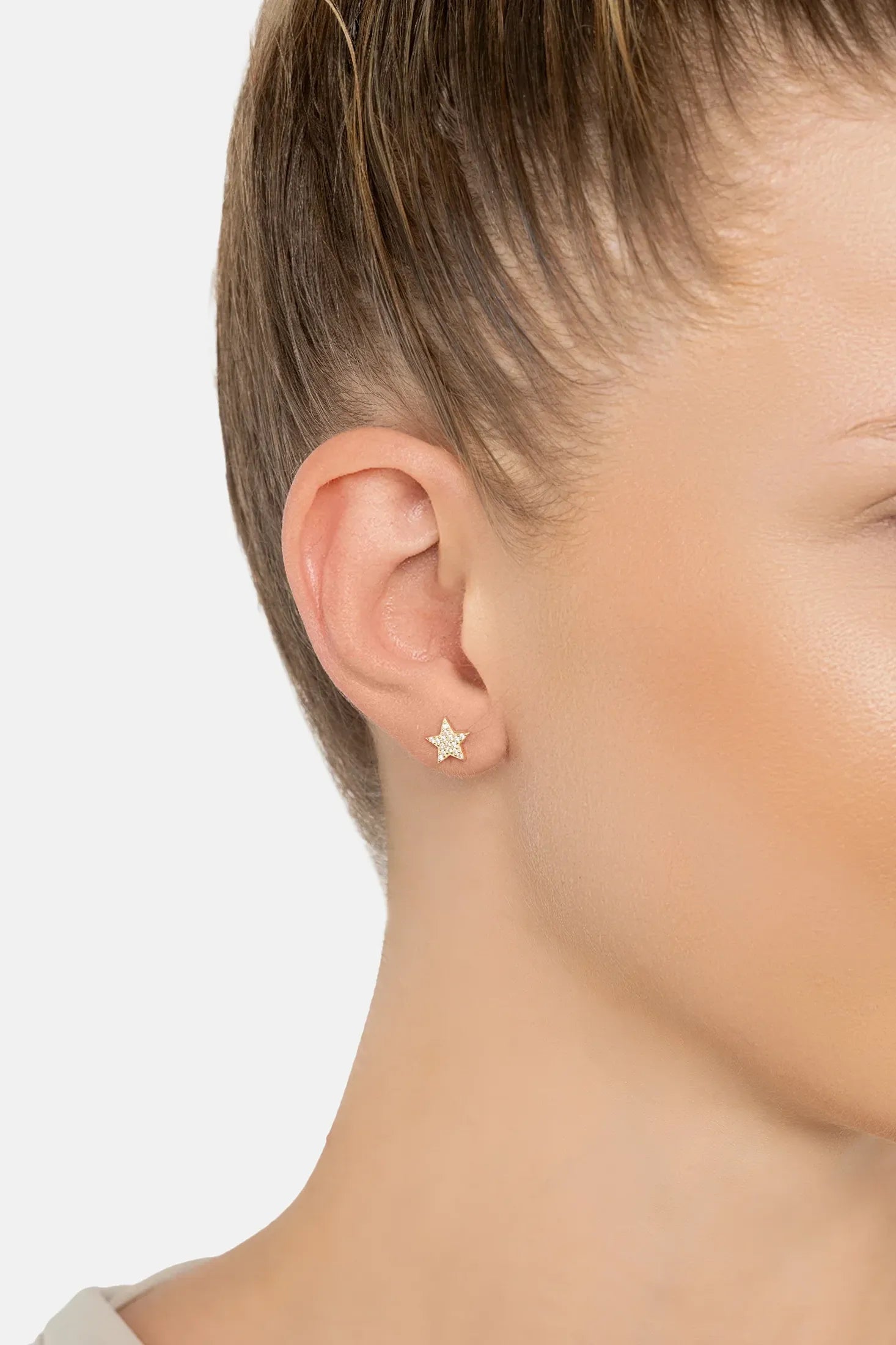 The earring worn by a model.