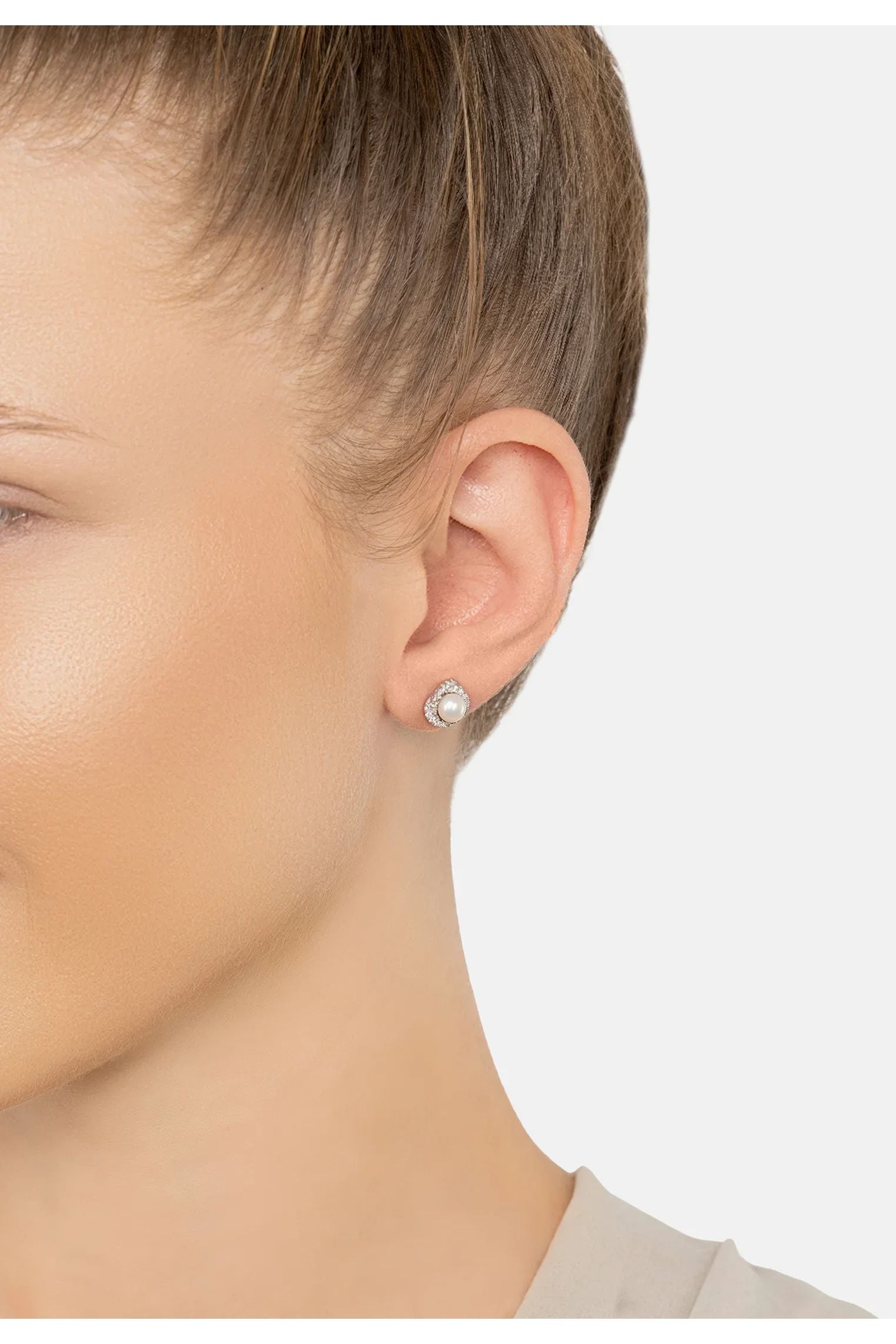 The earring worn by a model.