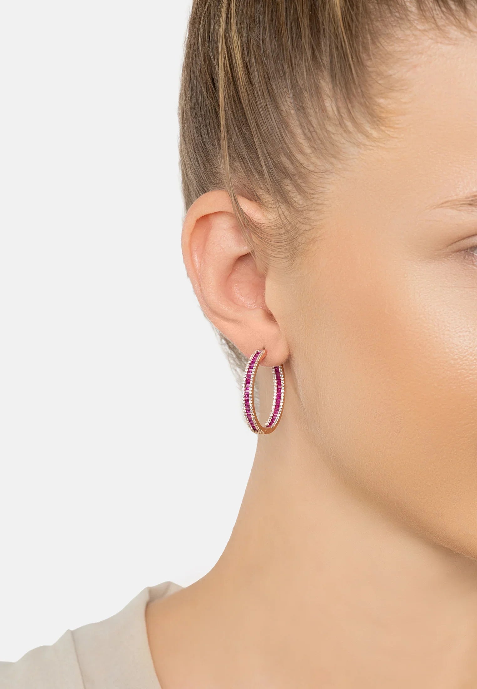 The earring worn by a model.