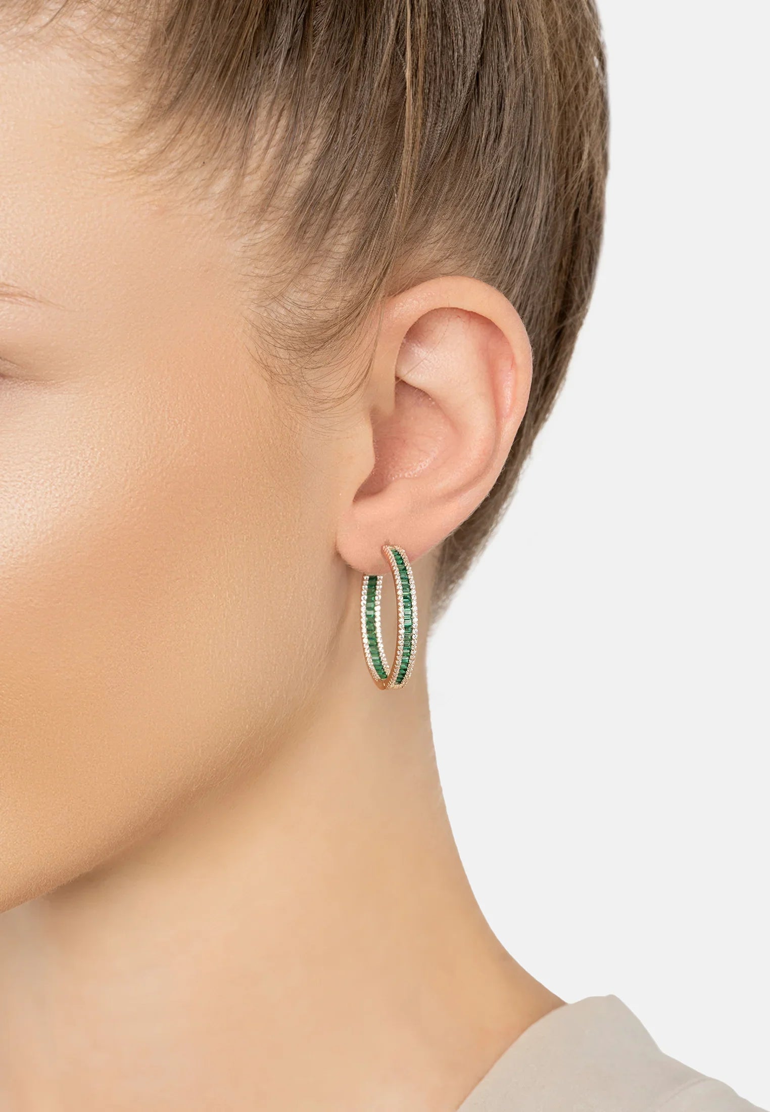 The earring worn by a model.