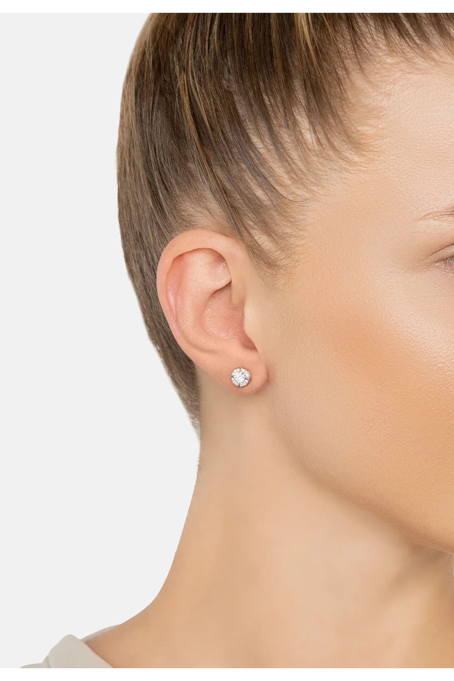 The earring worn by a model.