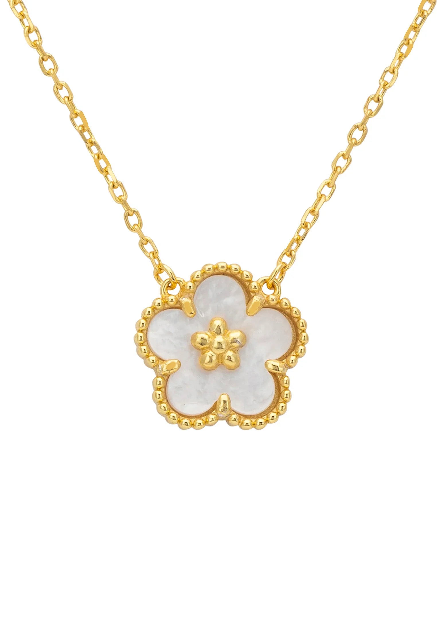 Close-up of the pearl flower gold charm.