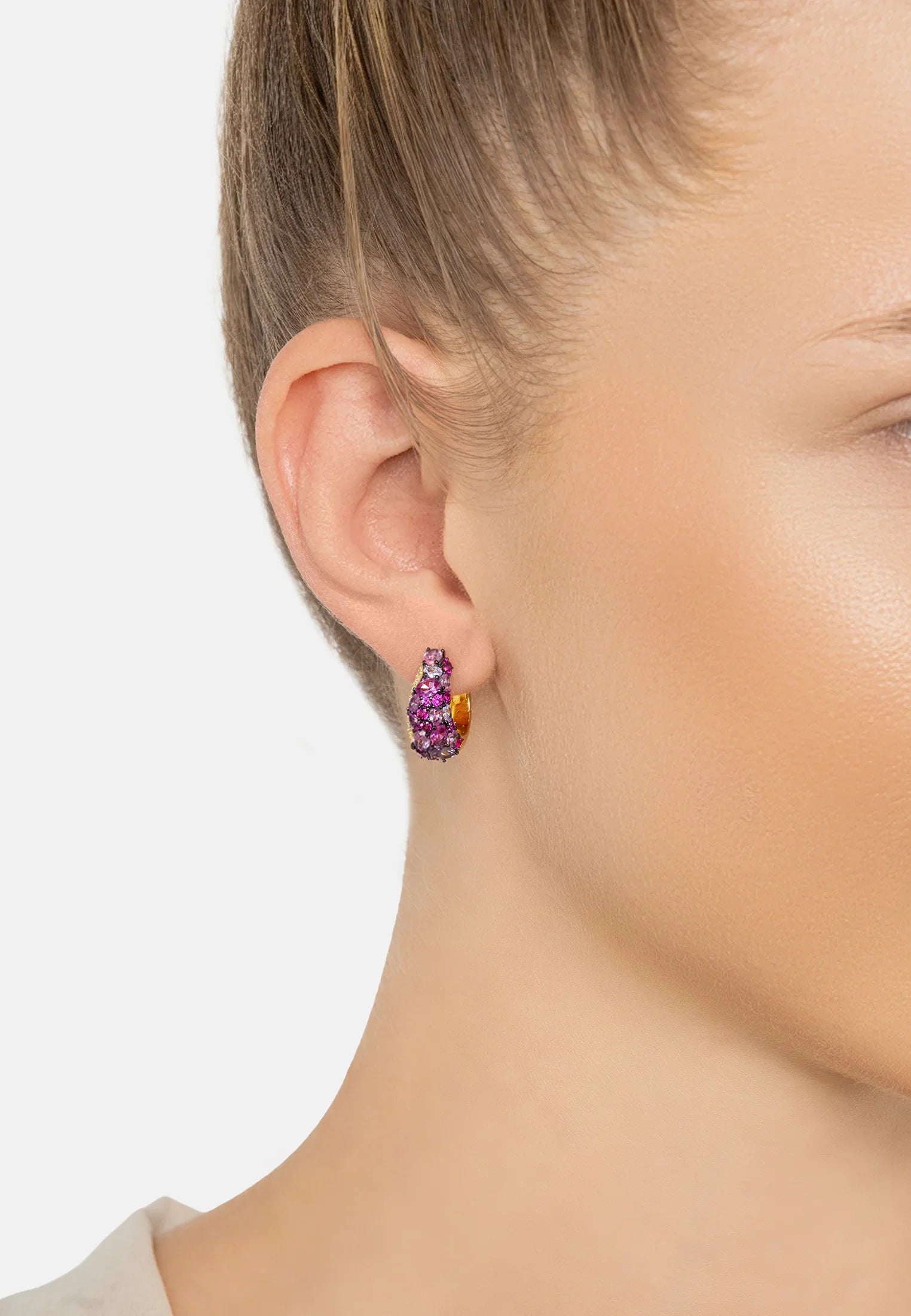 The earring worn by a model.