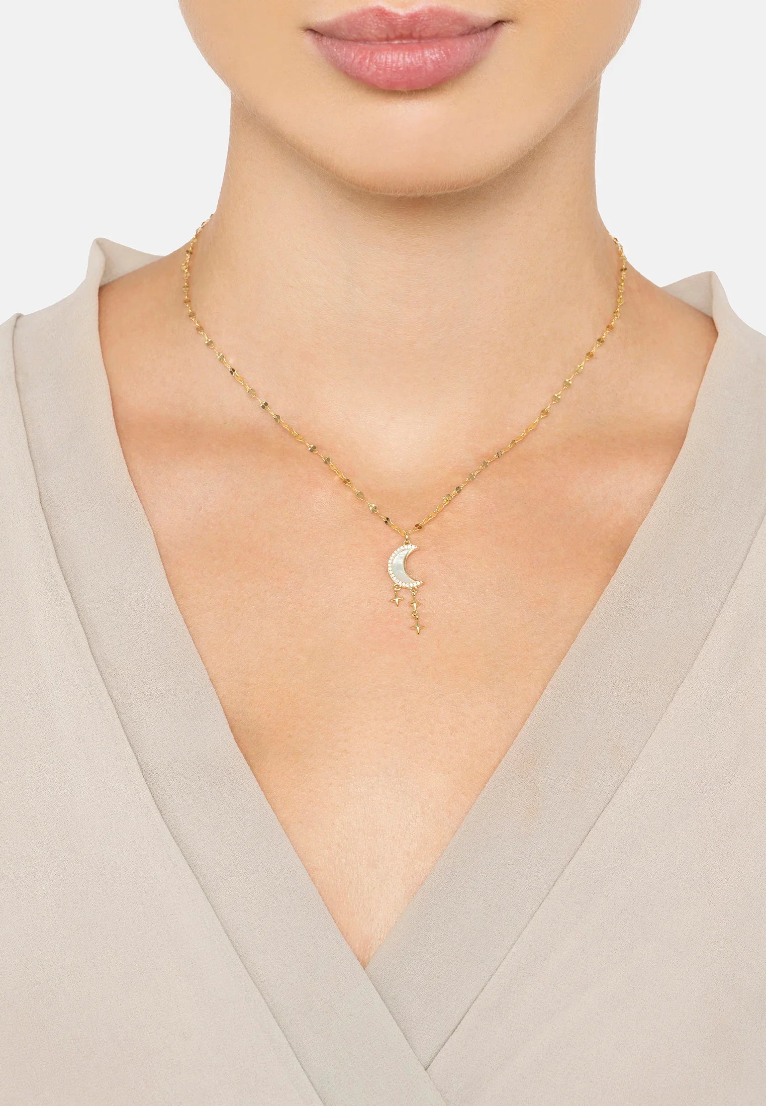 The necklace worn by a model.