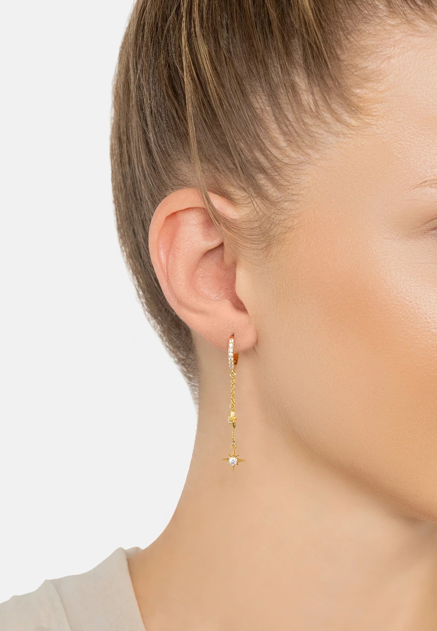 The earring worn by a model.