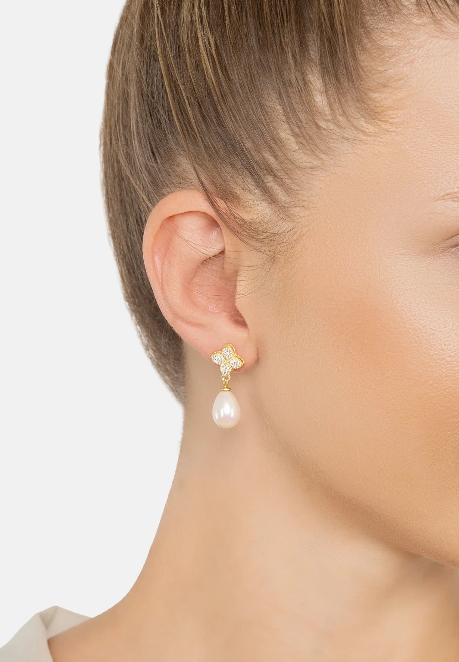 The earring worn by a model.