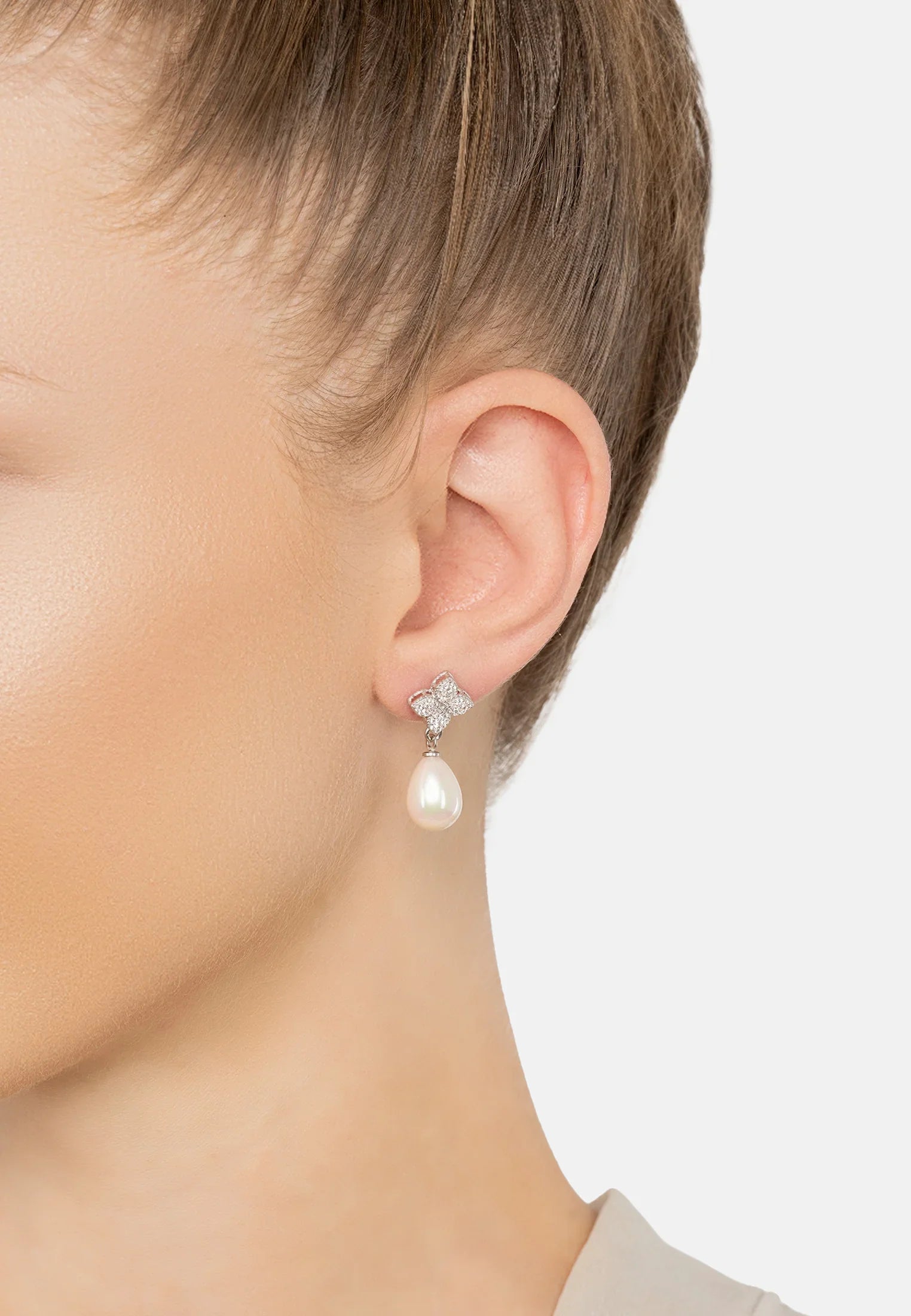 The earring worn by a model.