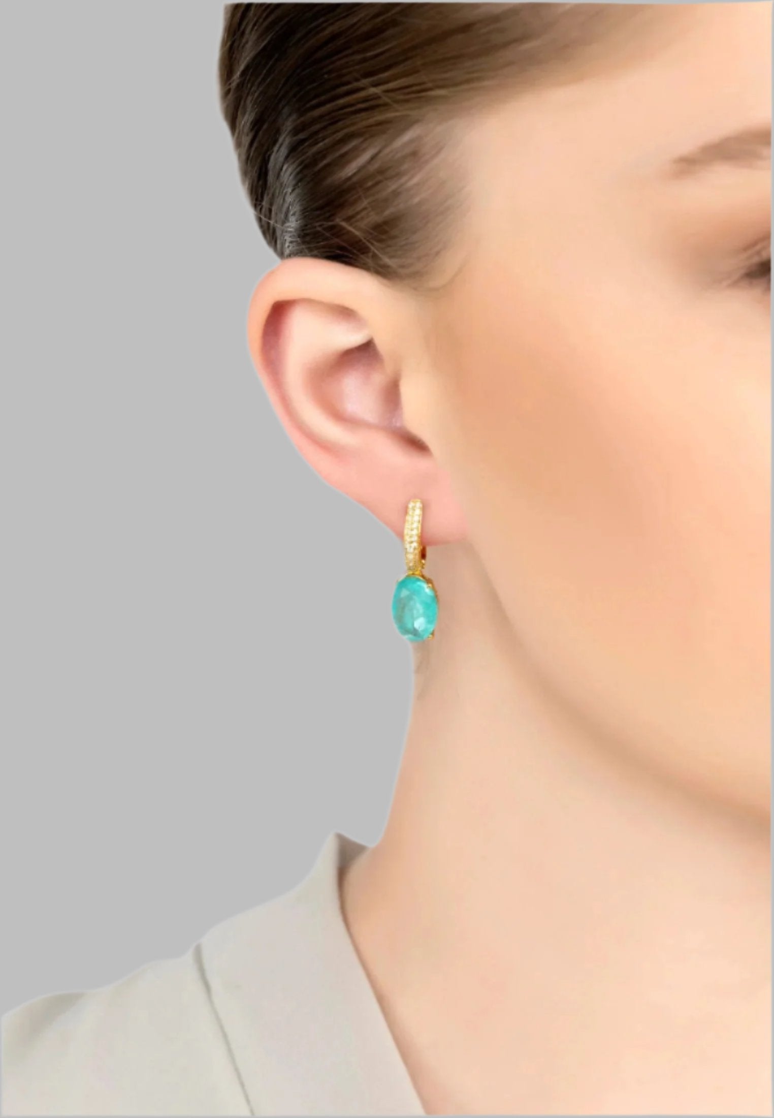 The earring worn by a model.