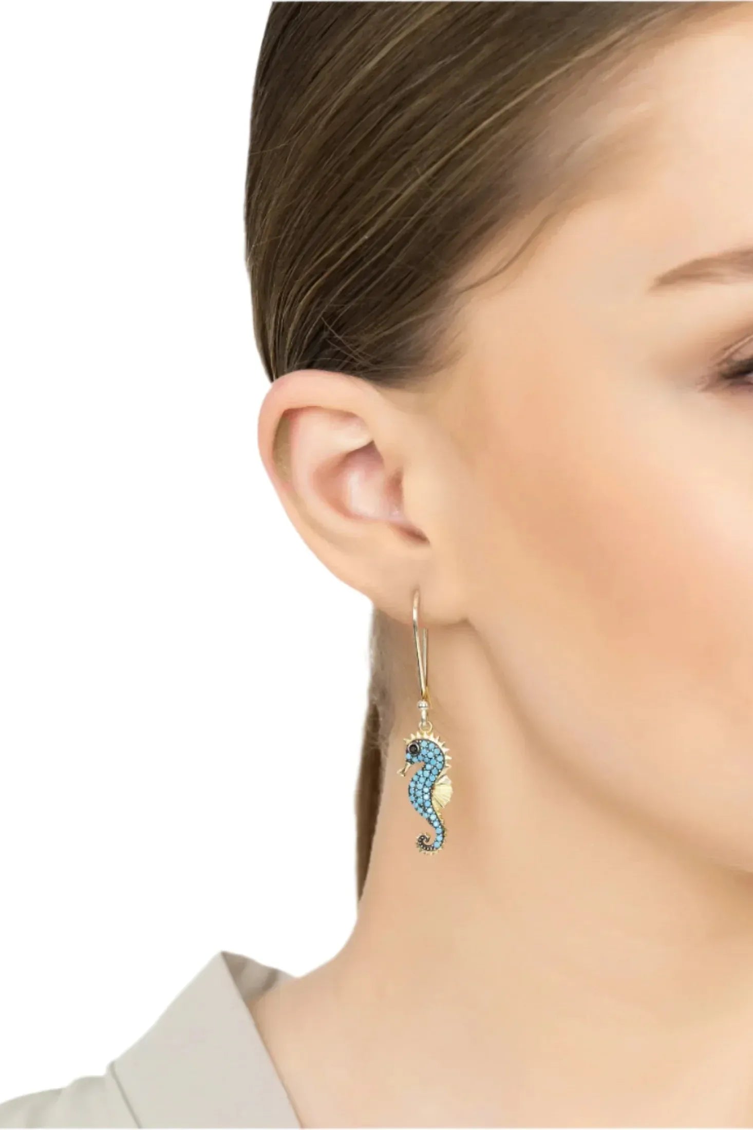 The earring worn by a model.