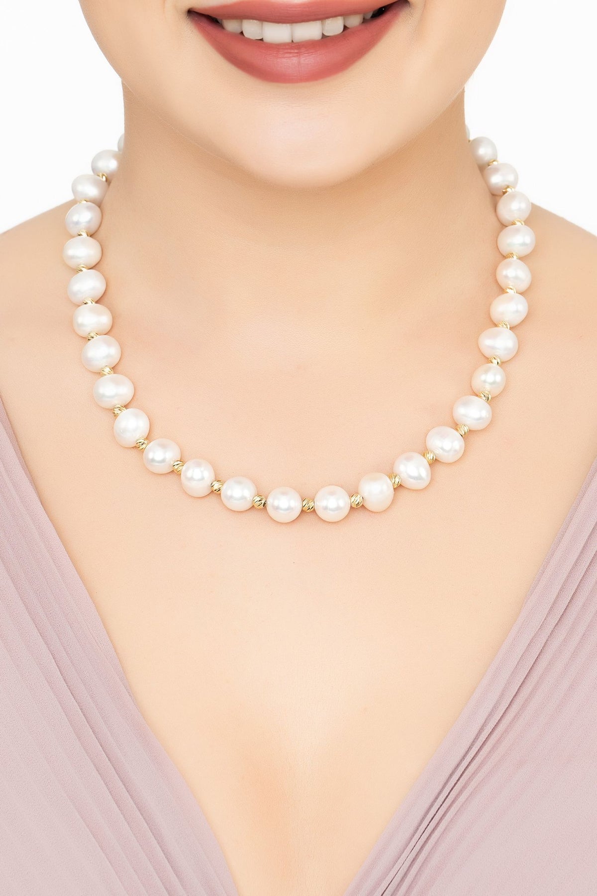 Angled view of Solid 14K Gold Classic Natural Pearl Necklace, showing pearl detailing, gold finish and the jewellery profile.