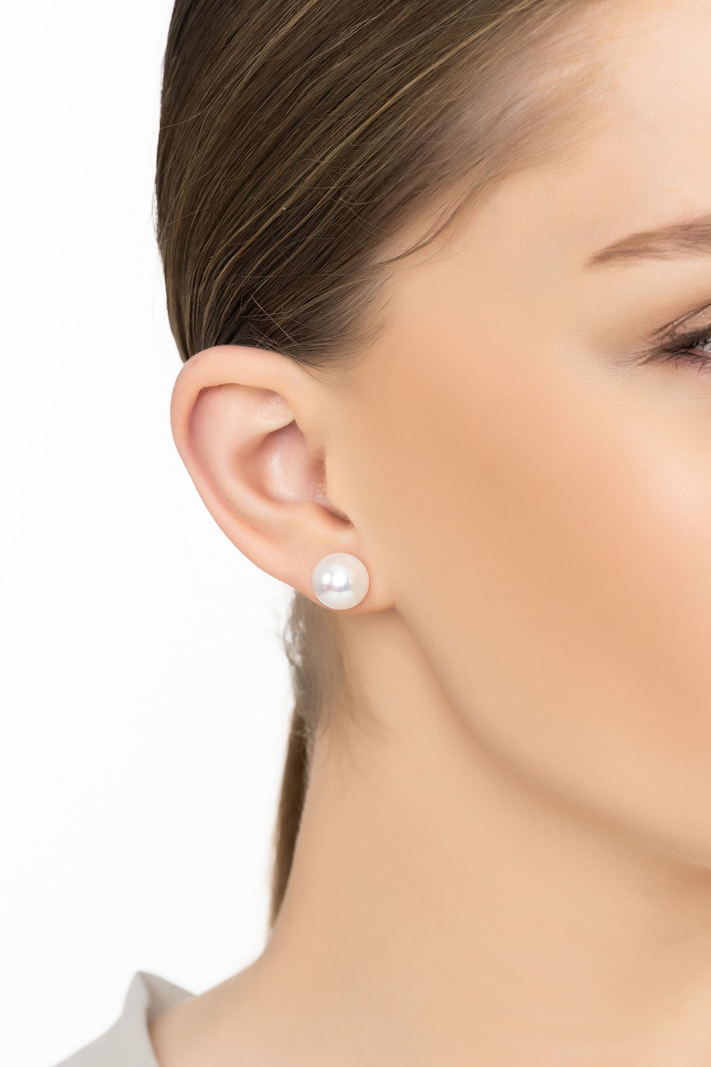 Angled view of Solid 14K White Gold 11mm Classic Natural Pearl Stud Earrings, showing pearl detailing, gold finish and the jewellery profile.