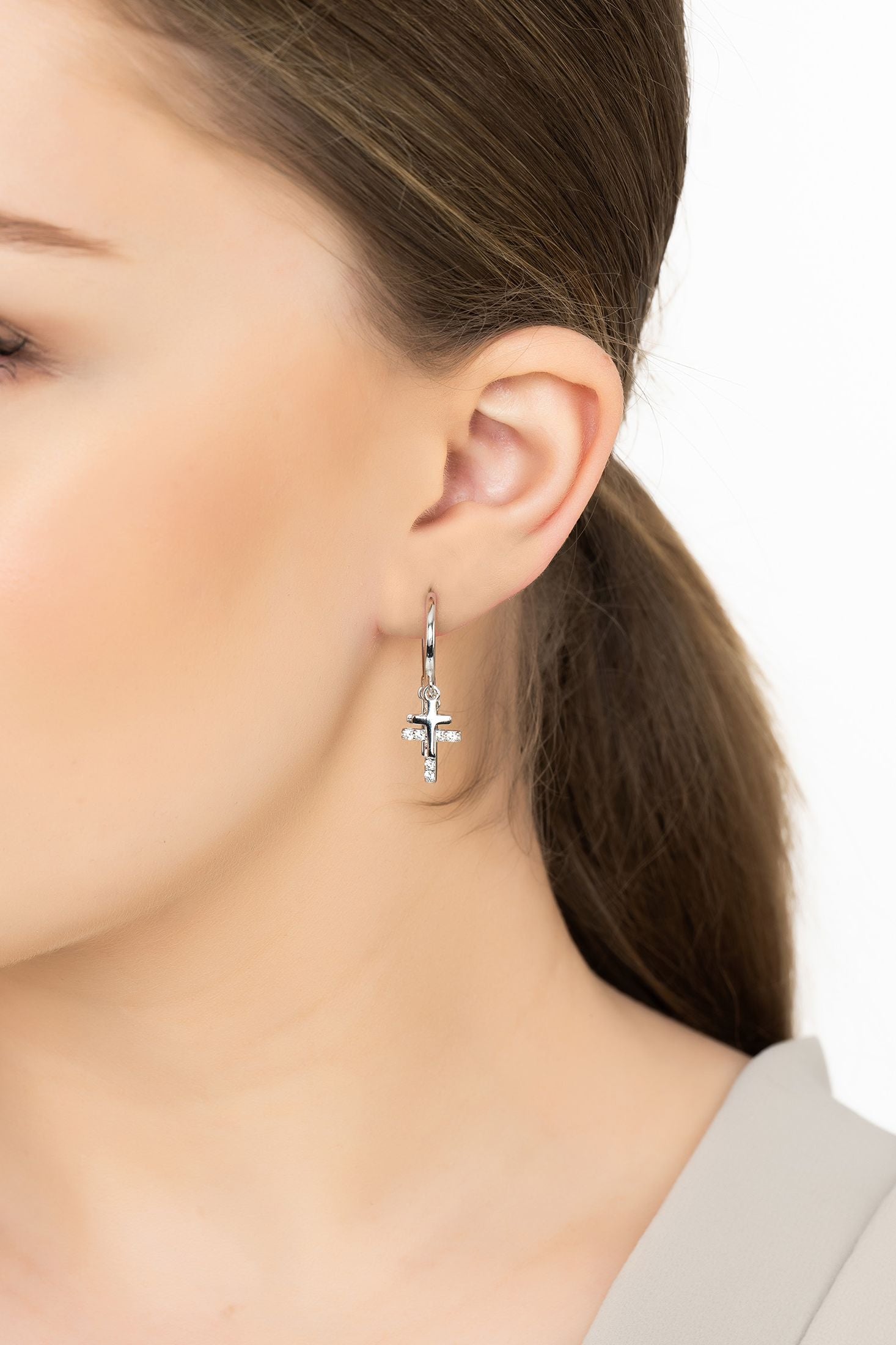 Angled view of Faith Triple Fashion Hoop Earrings Silver, showing silver finish and the jewellery profile.