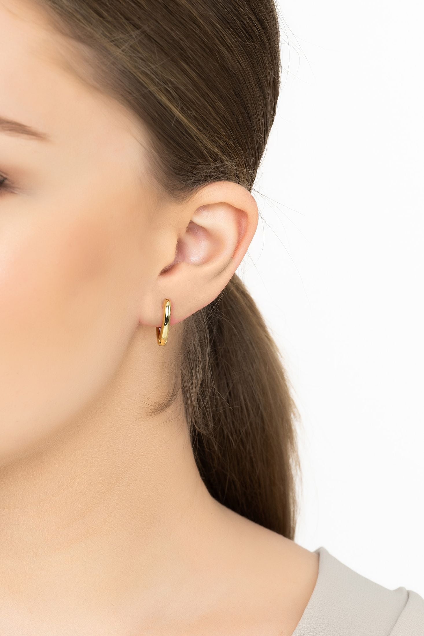 Angled view of My Love Heart Hoop Earrings Gold, showing heart design, gold finish and the jewellery profile.