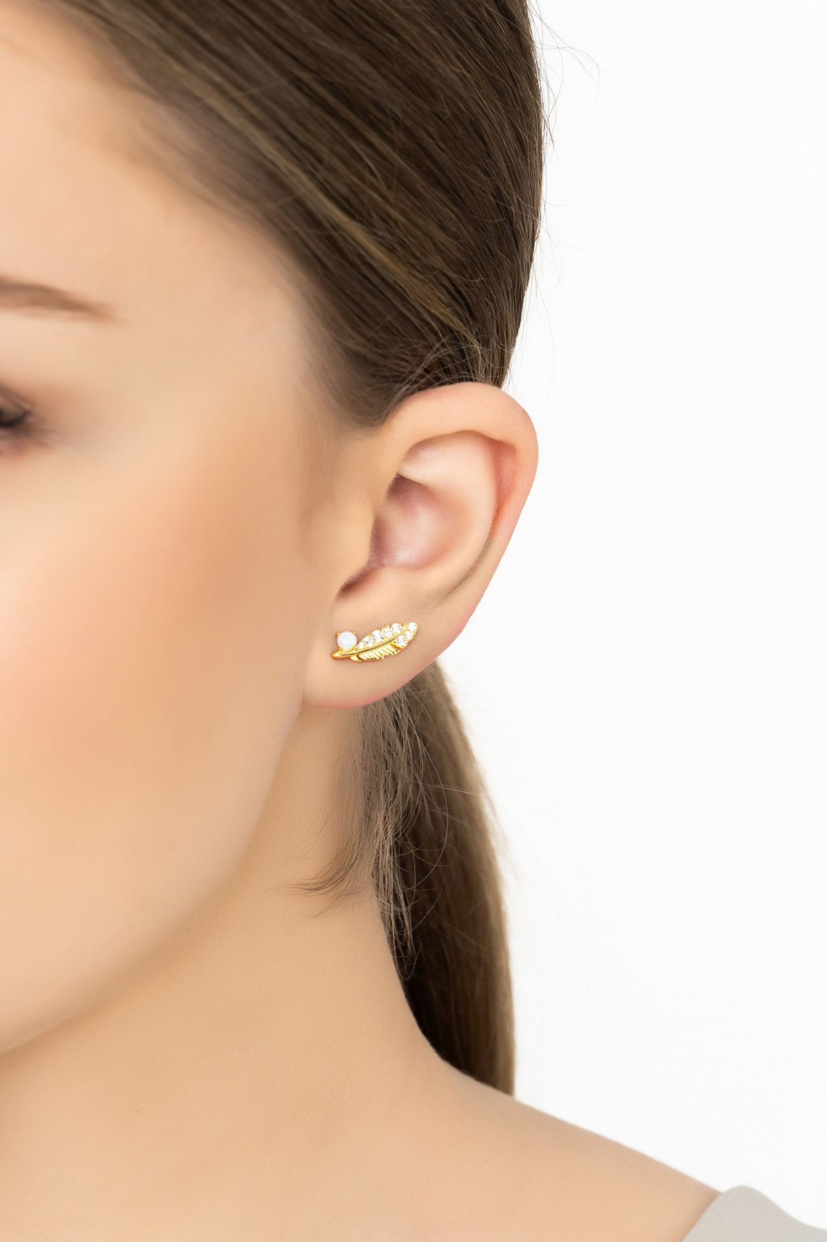 Angled view of Opal Leaf Stud Earrings Gold, showing leaf design, gold finish and the jewellery profile.