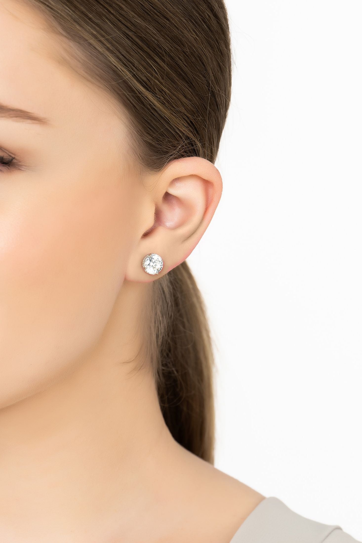 Angled view of Coronation Solitaire Stud Earrings Moissanite Silver, showing silver finish and the jewellery profile.