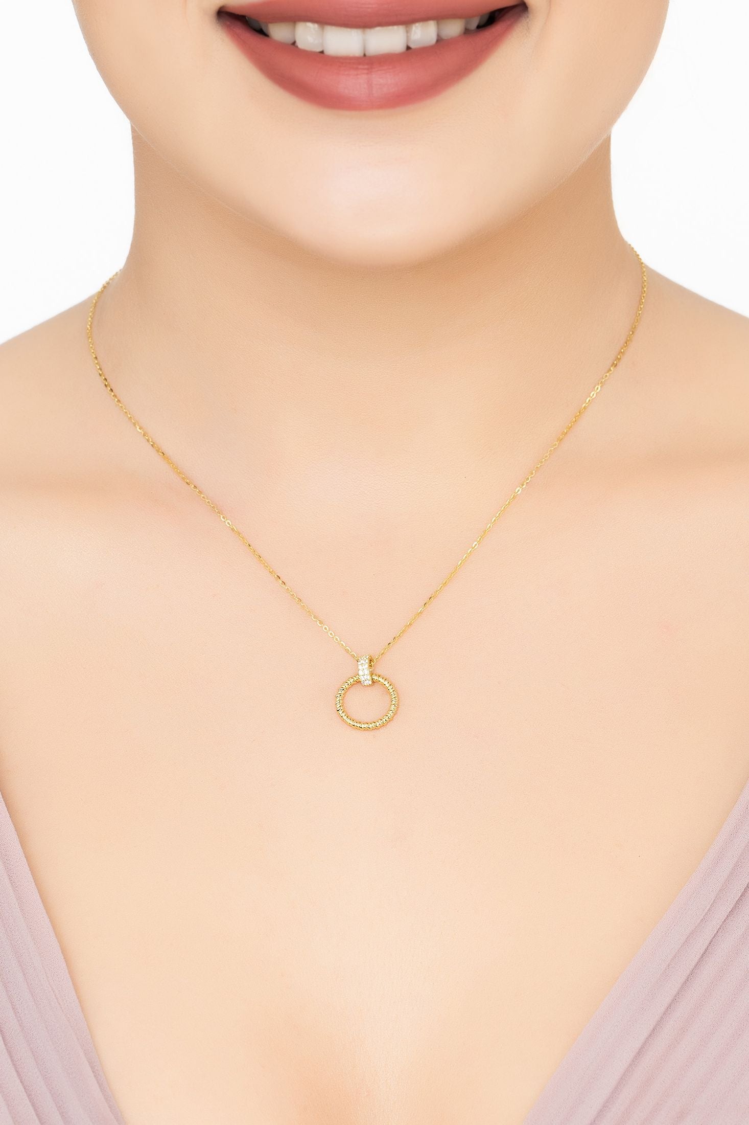 Angled view of Halo Eternal Bond Pendant Necklace Gold, showing gold finish and the jewellery profile.