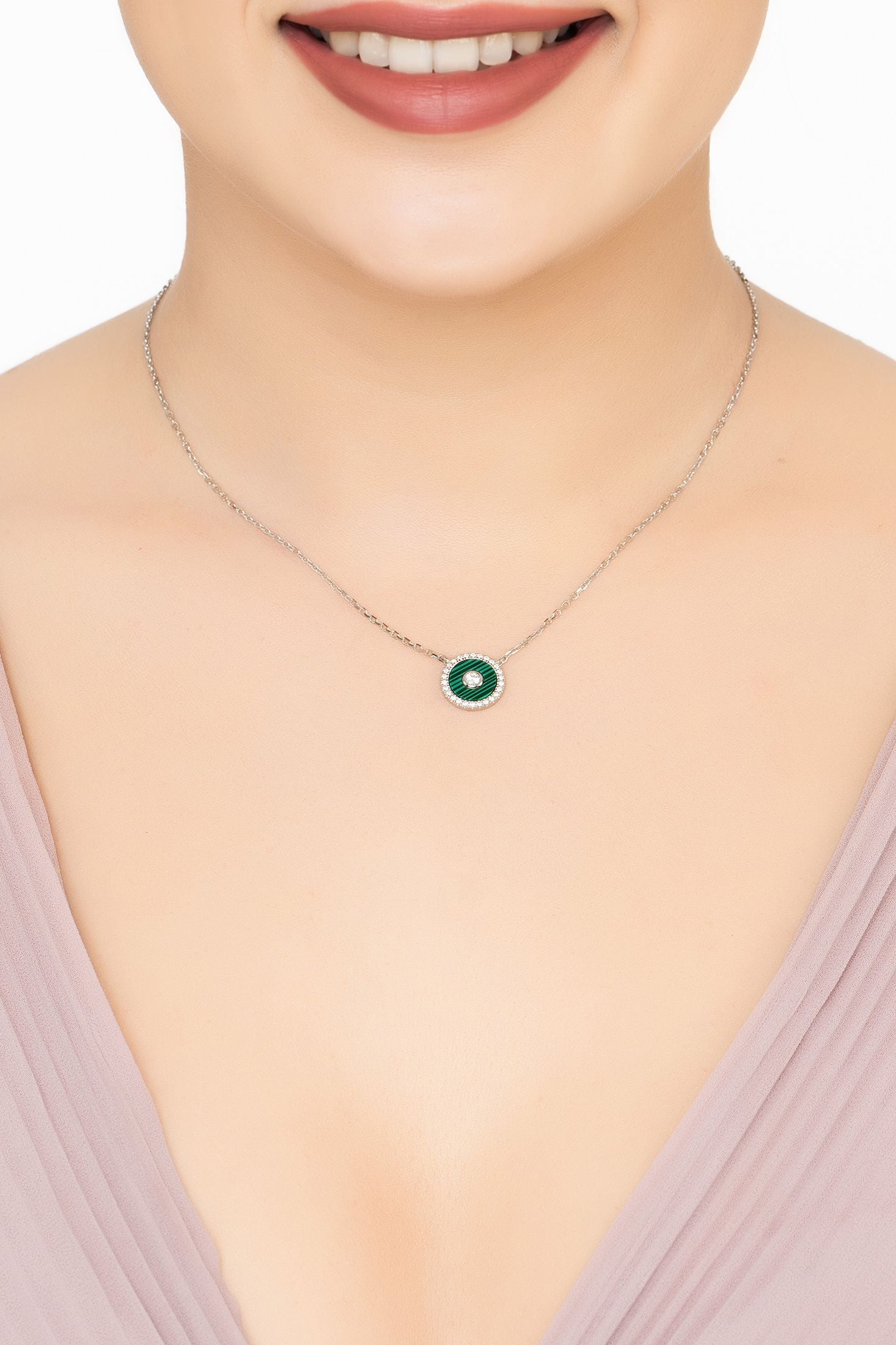 Angled view of Mystique Amulet Malachite Pendant Necklace Silver, showing malachite detailing, silver finish and the jewellery profile.