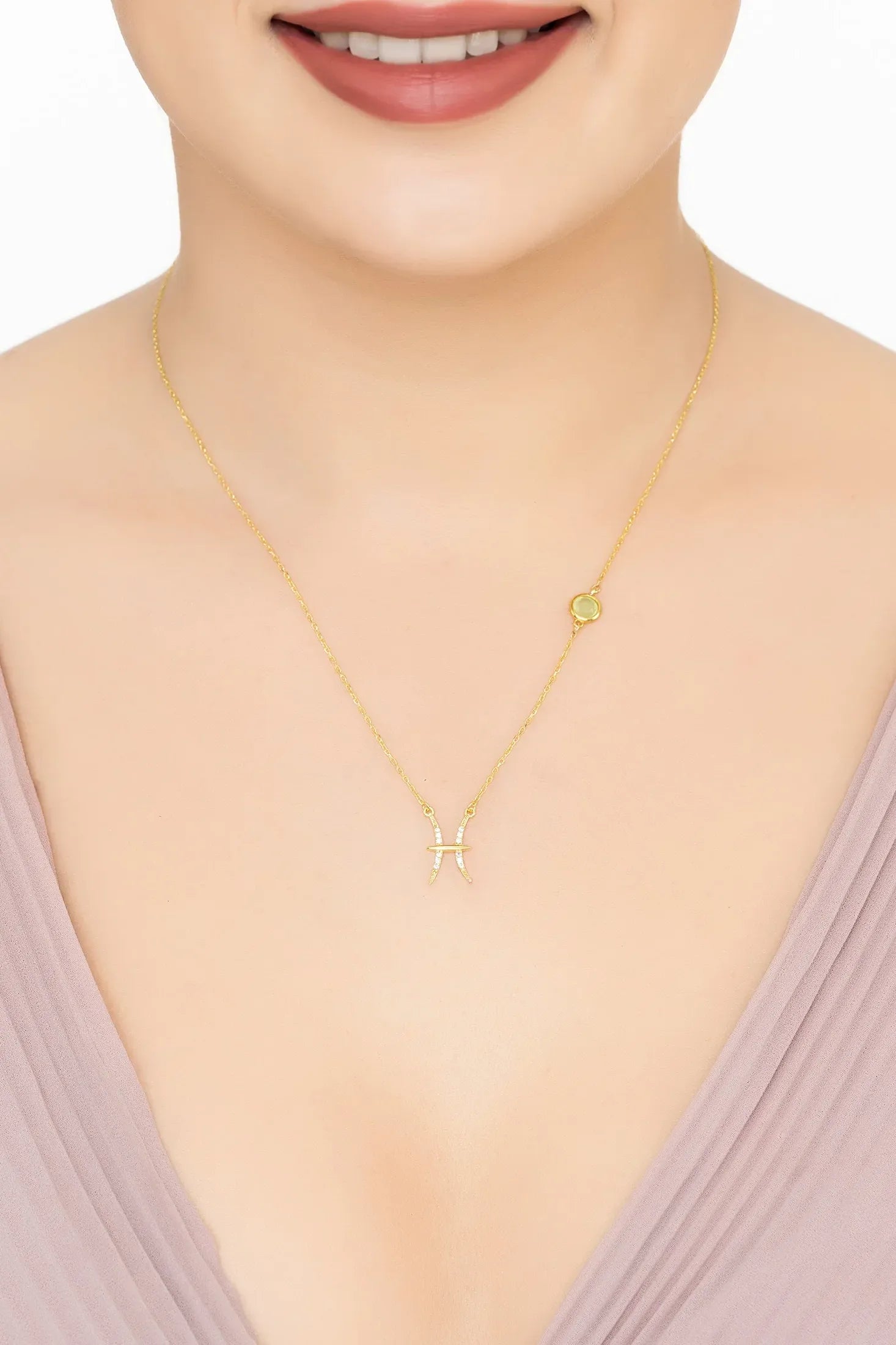 Angled view of Zodiac Birthstone Pisces Necklace Aqua Chalcedony Gold, showing zodiac design, aqua chalcedony and chalcedony detailing, gold finish and the jewellery profile.