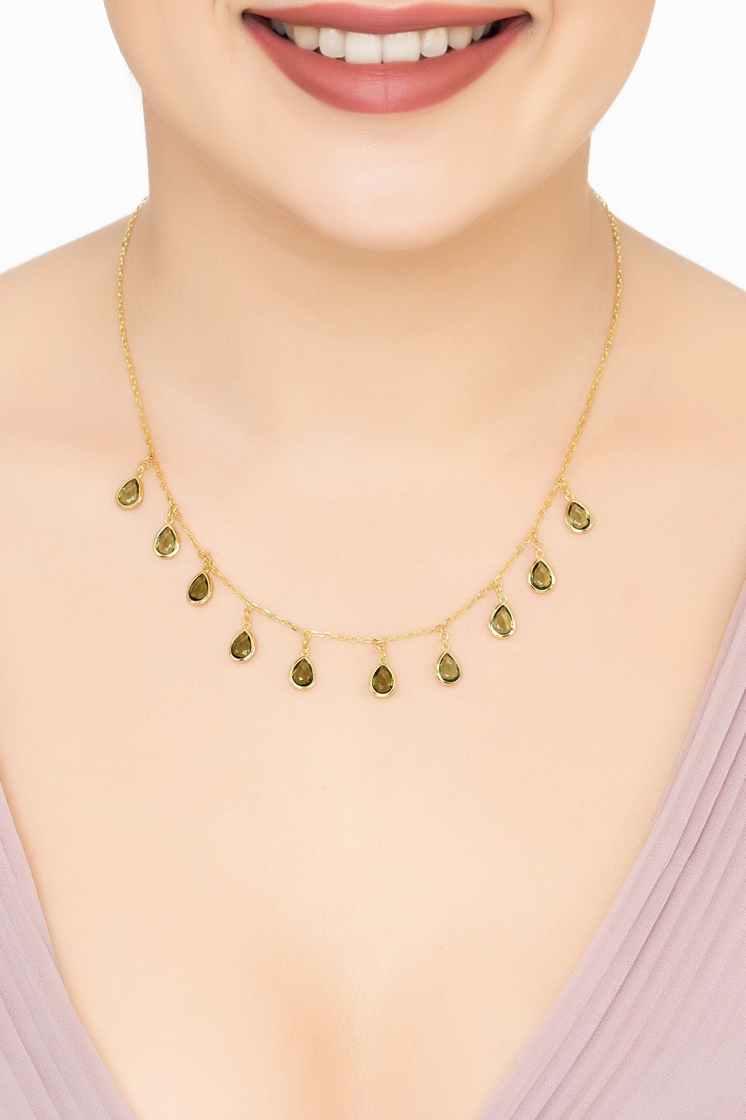 Angled view of Florence Teardrop Gemstone Necklace Gold Peridot, showing peridot detailing, gold finish and the jewellery profile.