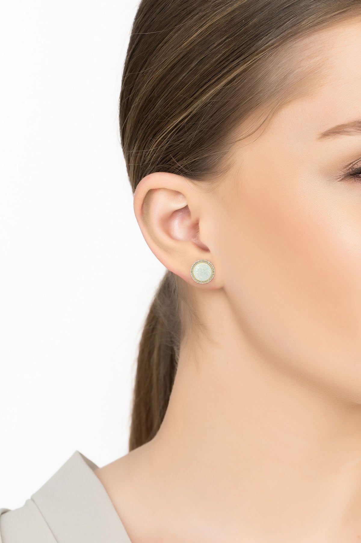 Angled view of Large Sparkling Halo Opal Stud Earrings Gold, showing gold finish and the jewellery profile.