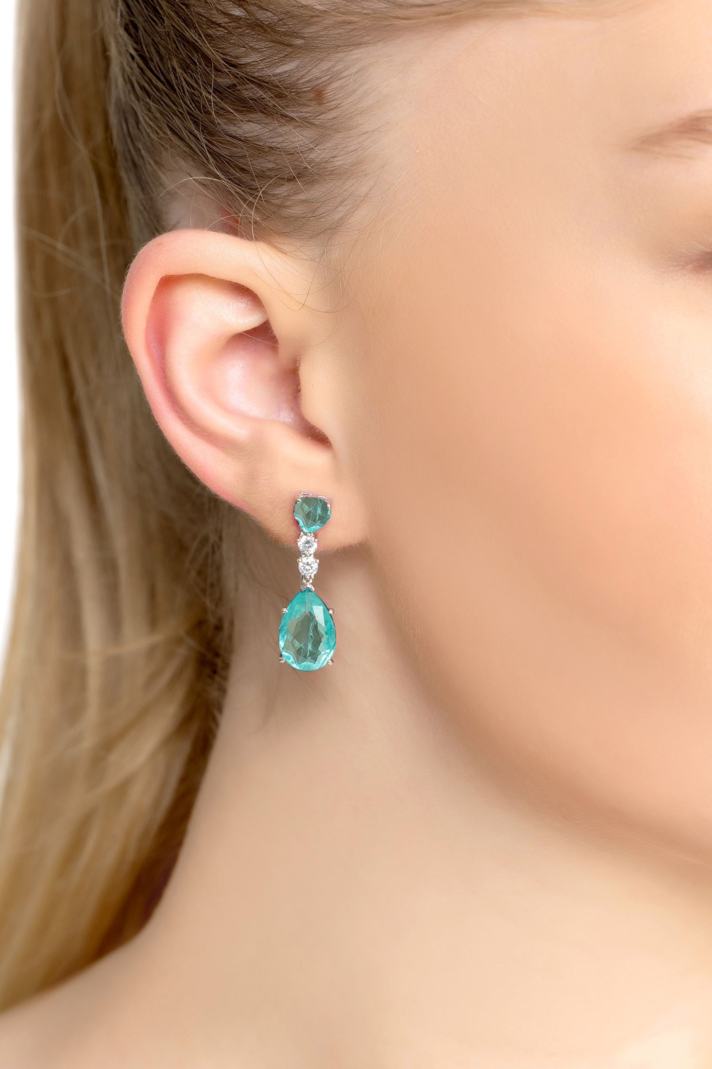 Angled view of Augusta Paraiba Tourmaline Teardrop Earrings Silver, showing silver finish and the jewellery profile.