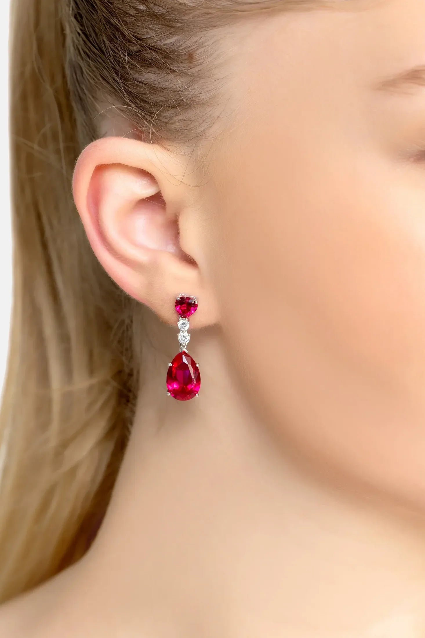 The earring worn by a model.
