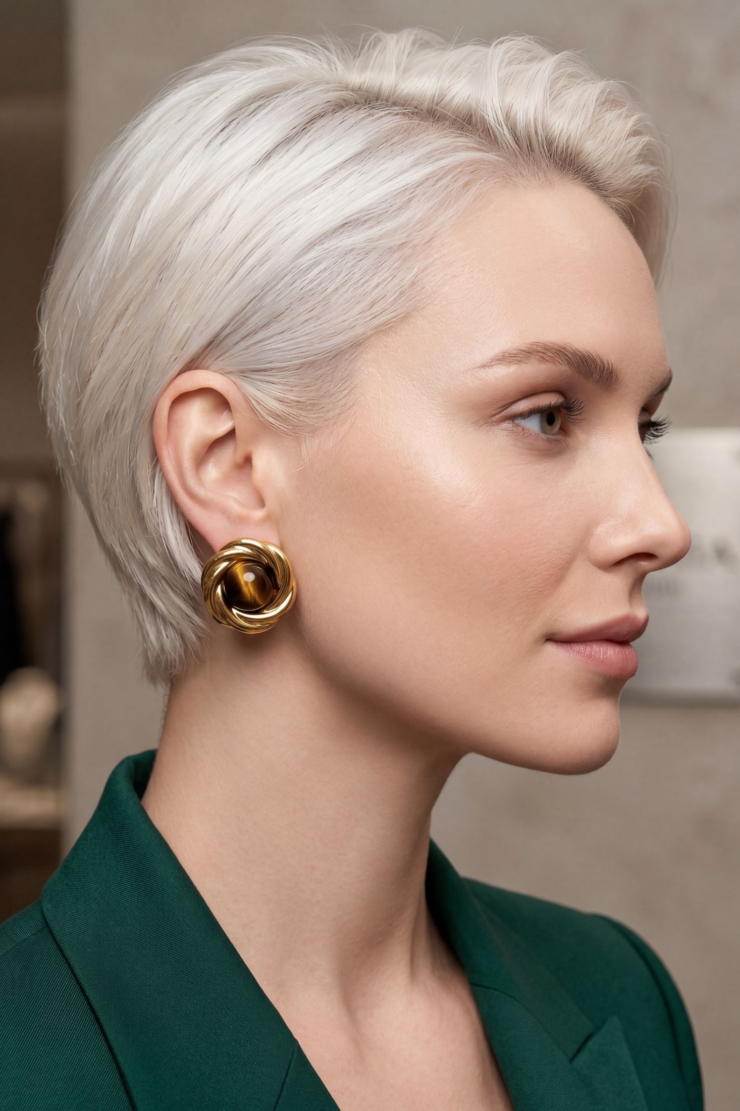 Angled view of Dynasty Tigers Eye Knot Stud Earrings Gold, showing gold finish and the jewellery profile.