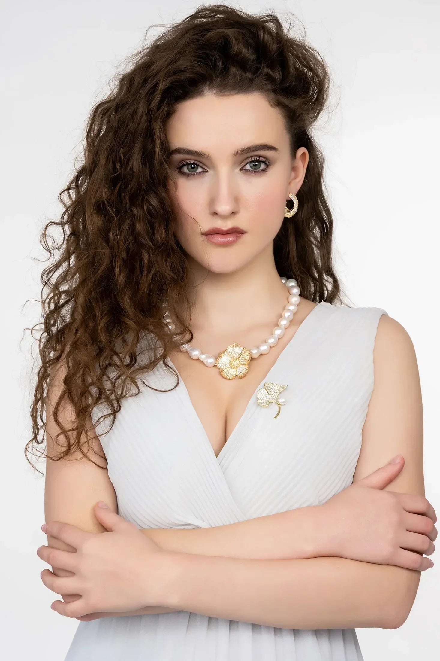 Close-up of Ginkgo Leaf And Pearl Brooch Gold, highlighting leaf design, pearl detailing, gold finish.
