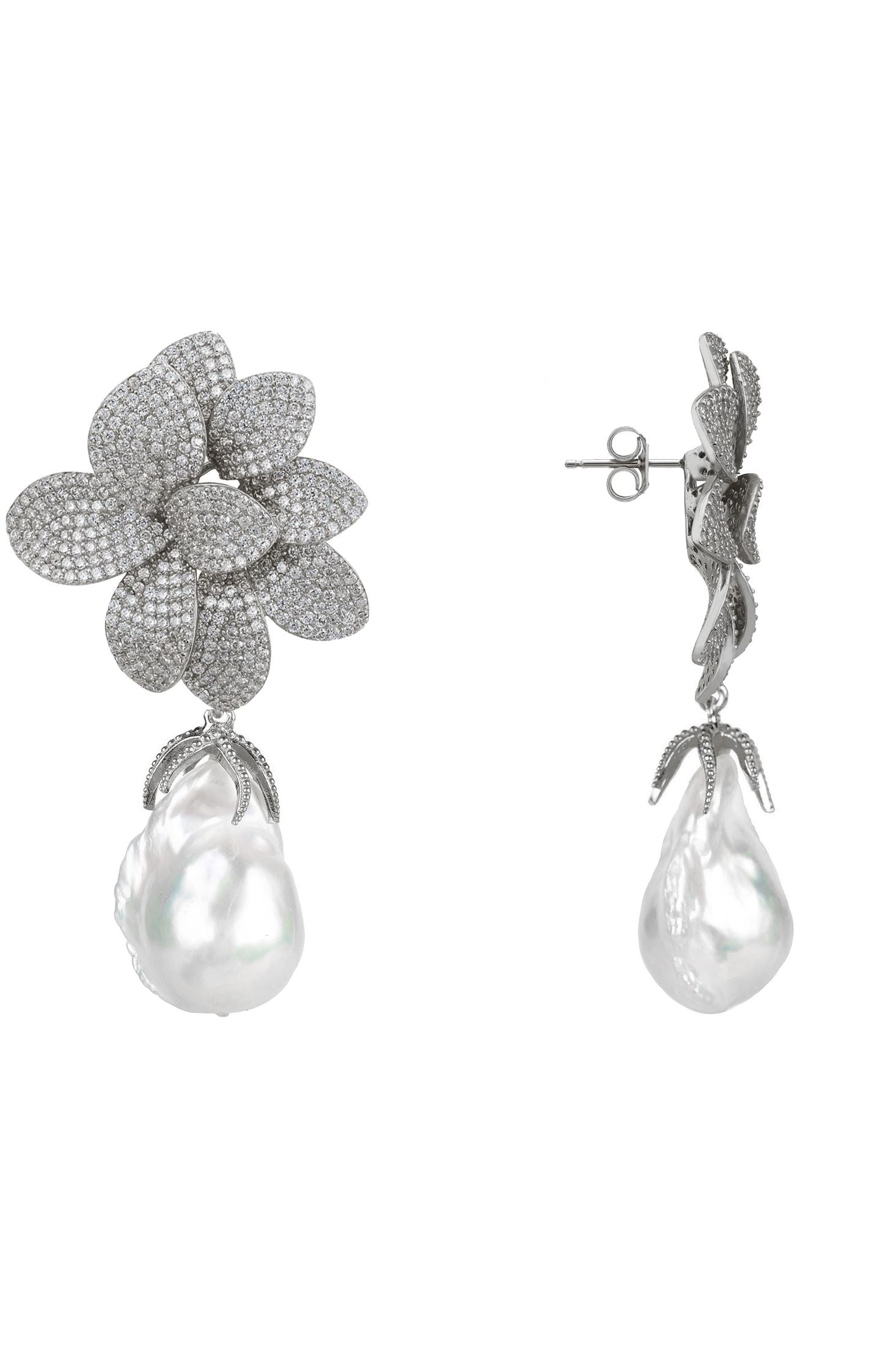 Pair of silver floral earrings with pearl drops on a white background
