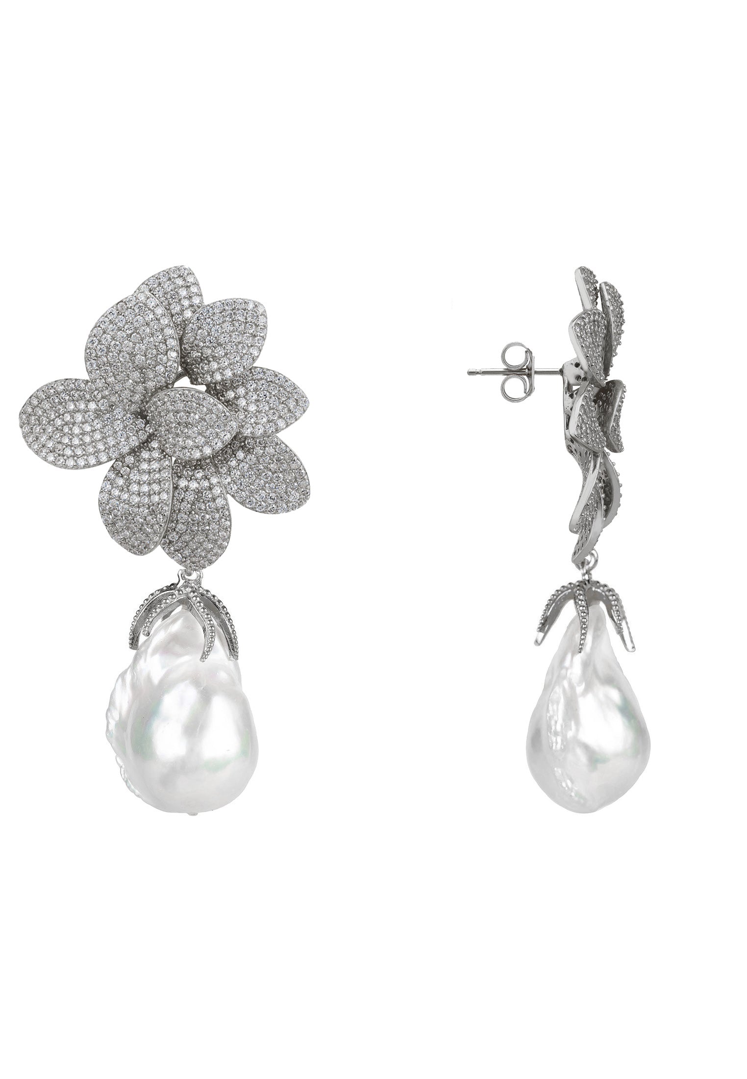 Pair of silver floral earrings with pearl drops on a white background