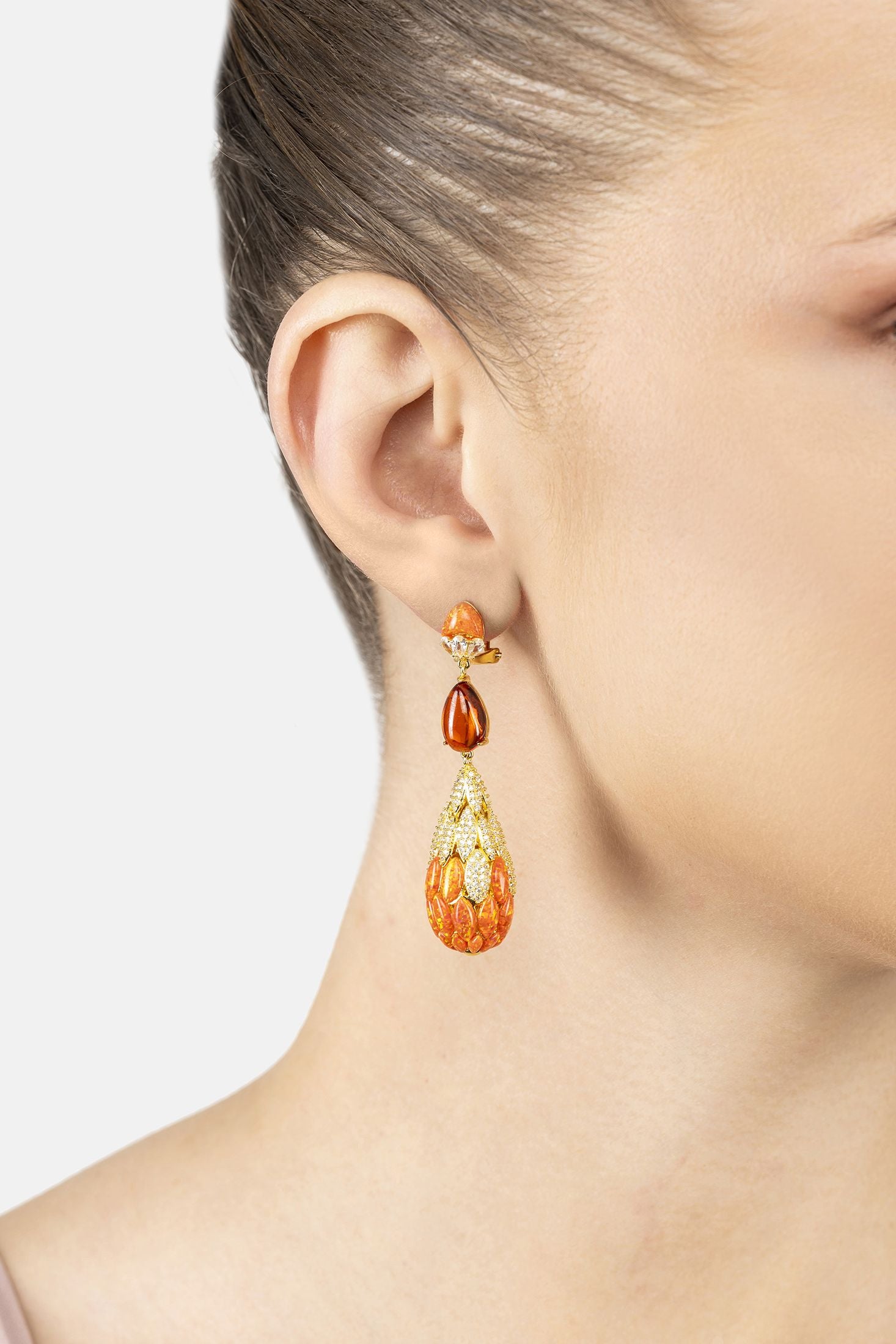 Angled view of Carmen Fire Opal Drop Earrings Gold, showing gold finish and the jewellery profile.