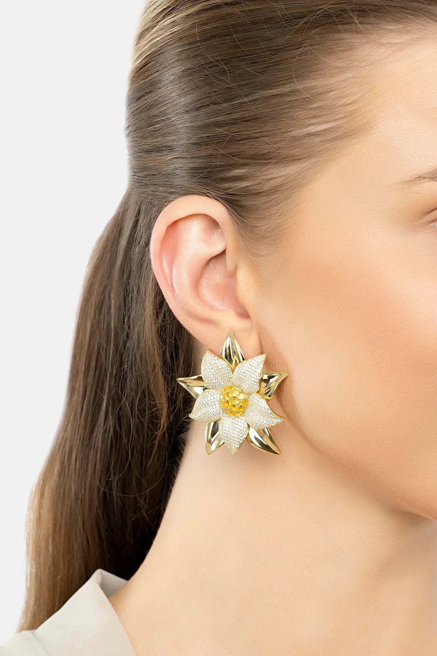 The earring worn by a model.