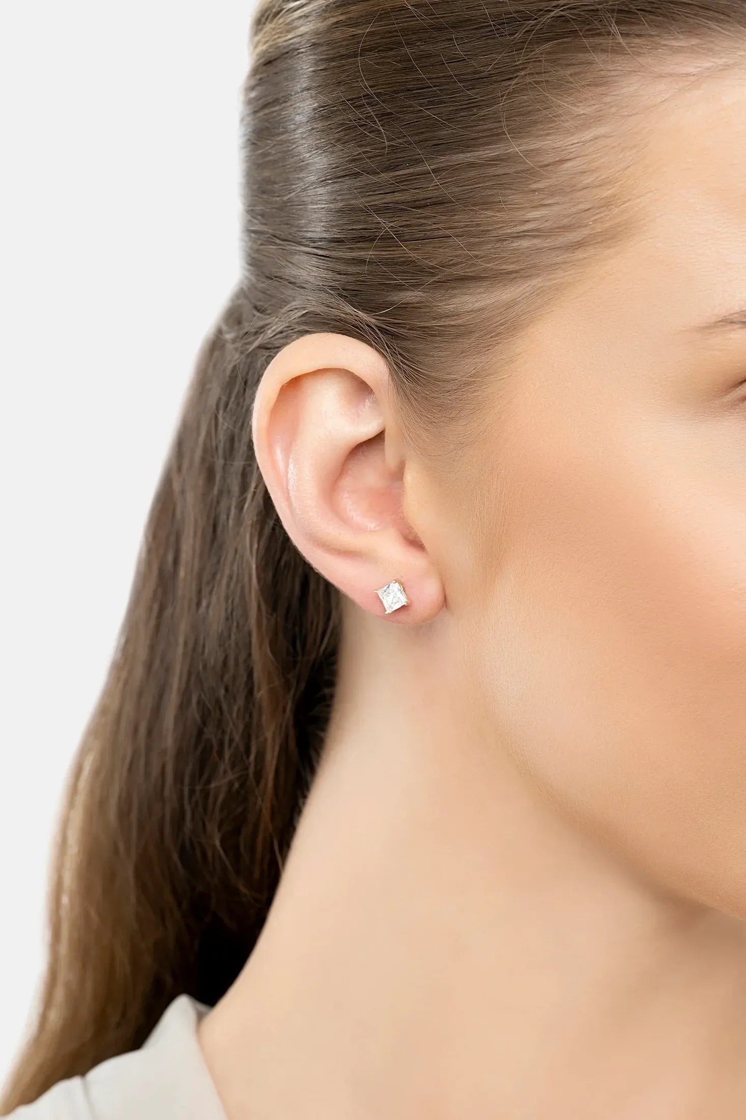 The earring worn by a model.