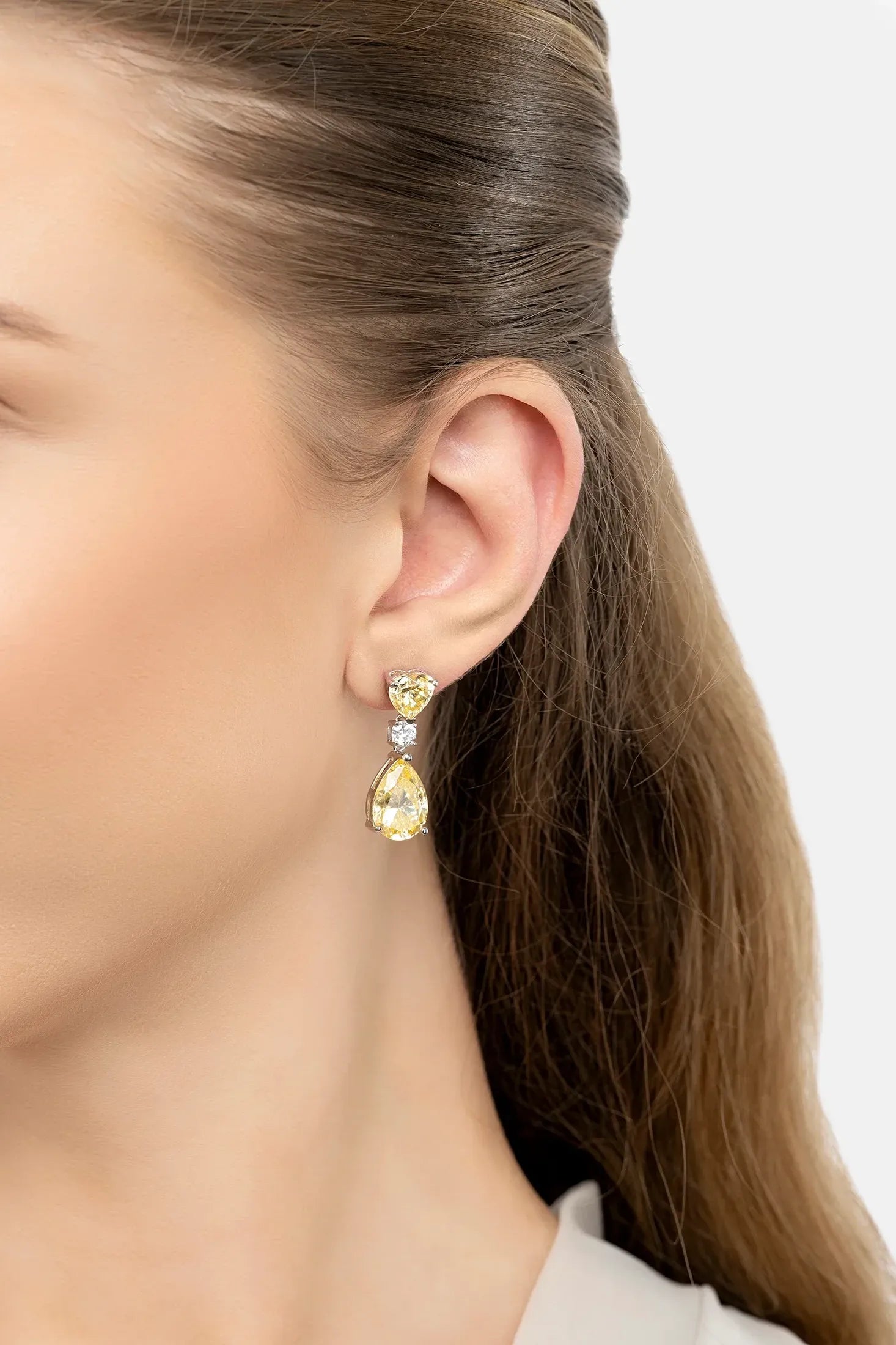 The earring worn by a model.