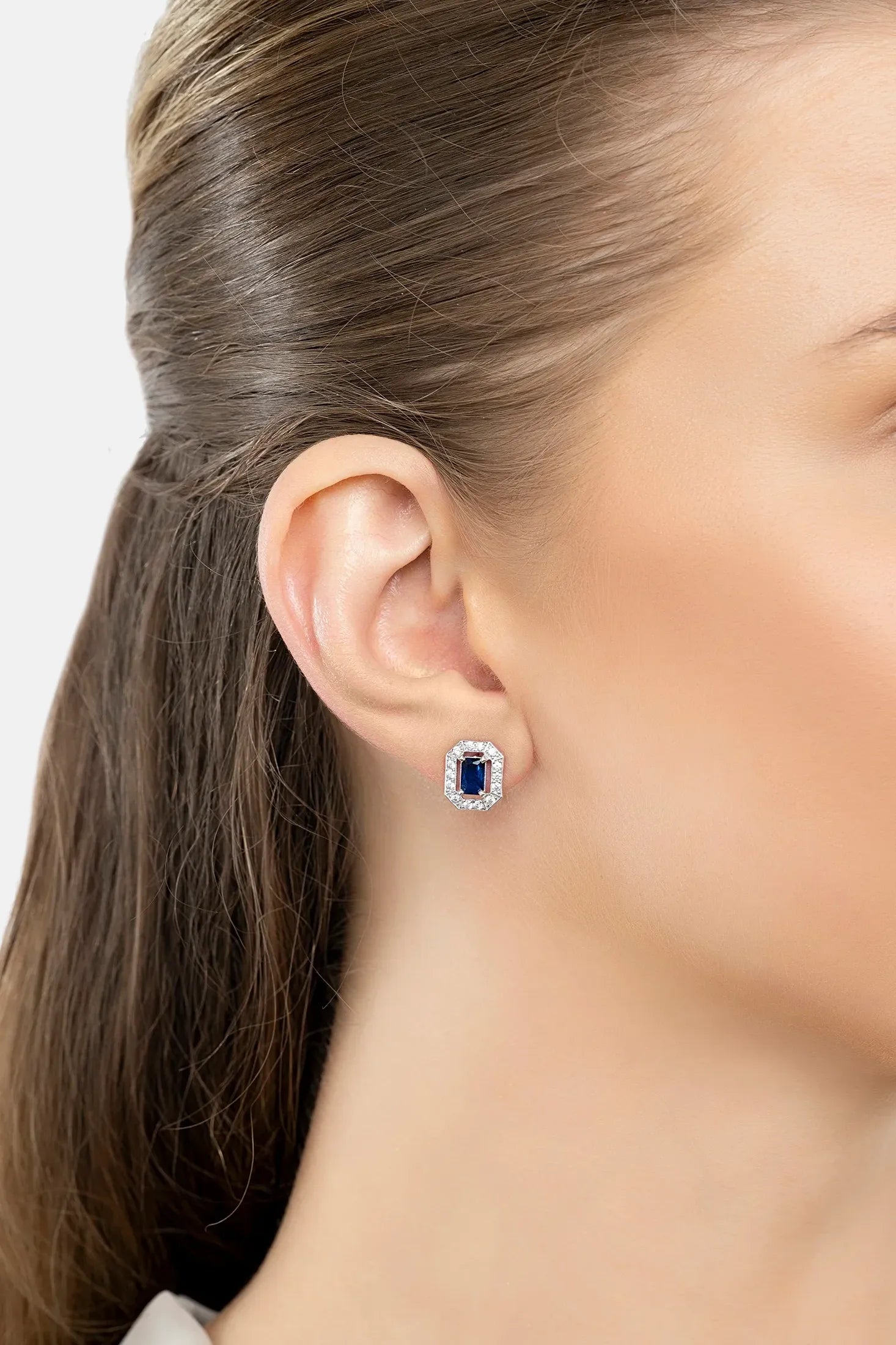 The earring worn by a model.