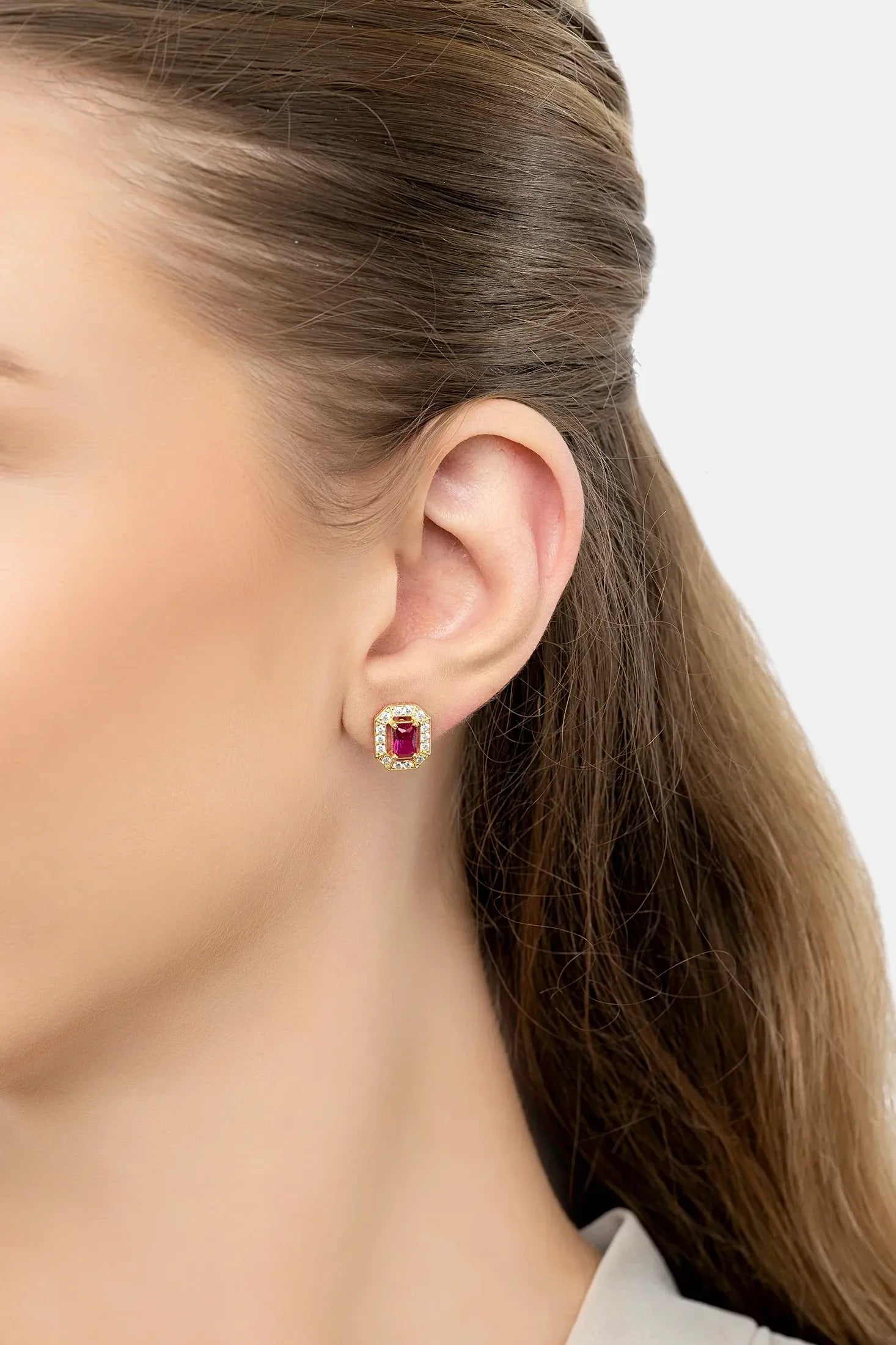 The earring worn by a model.