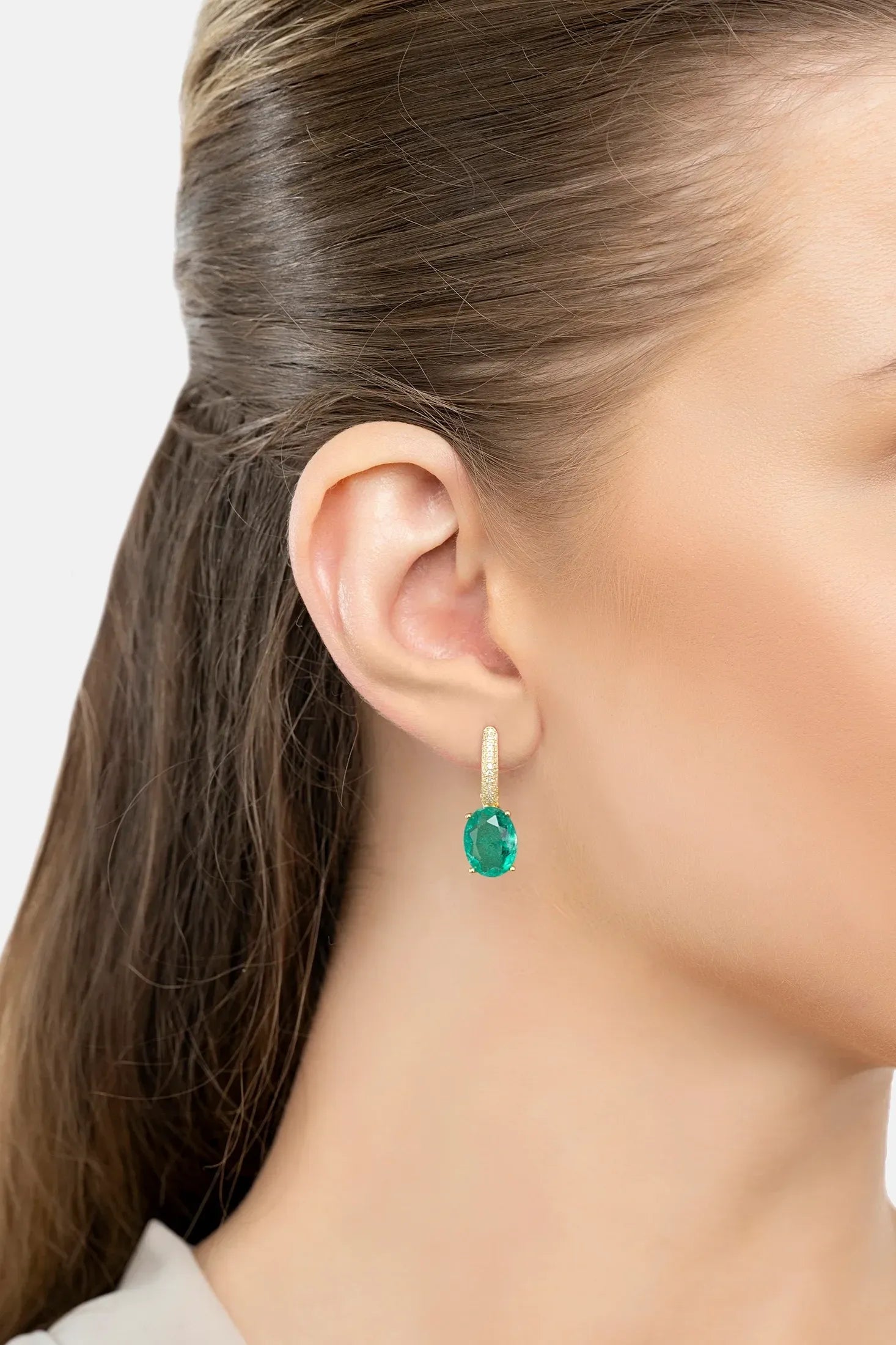 The earring worn by a model.