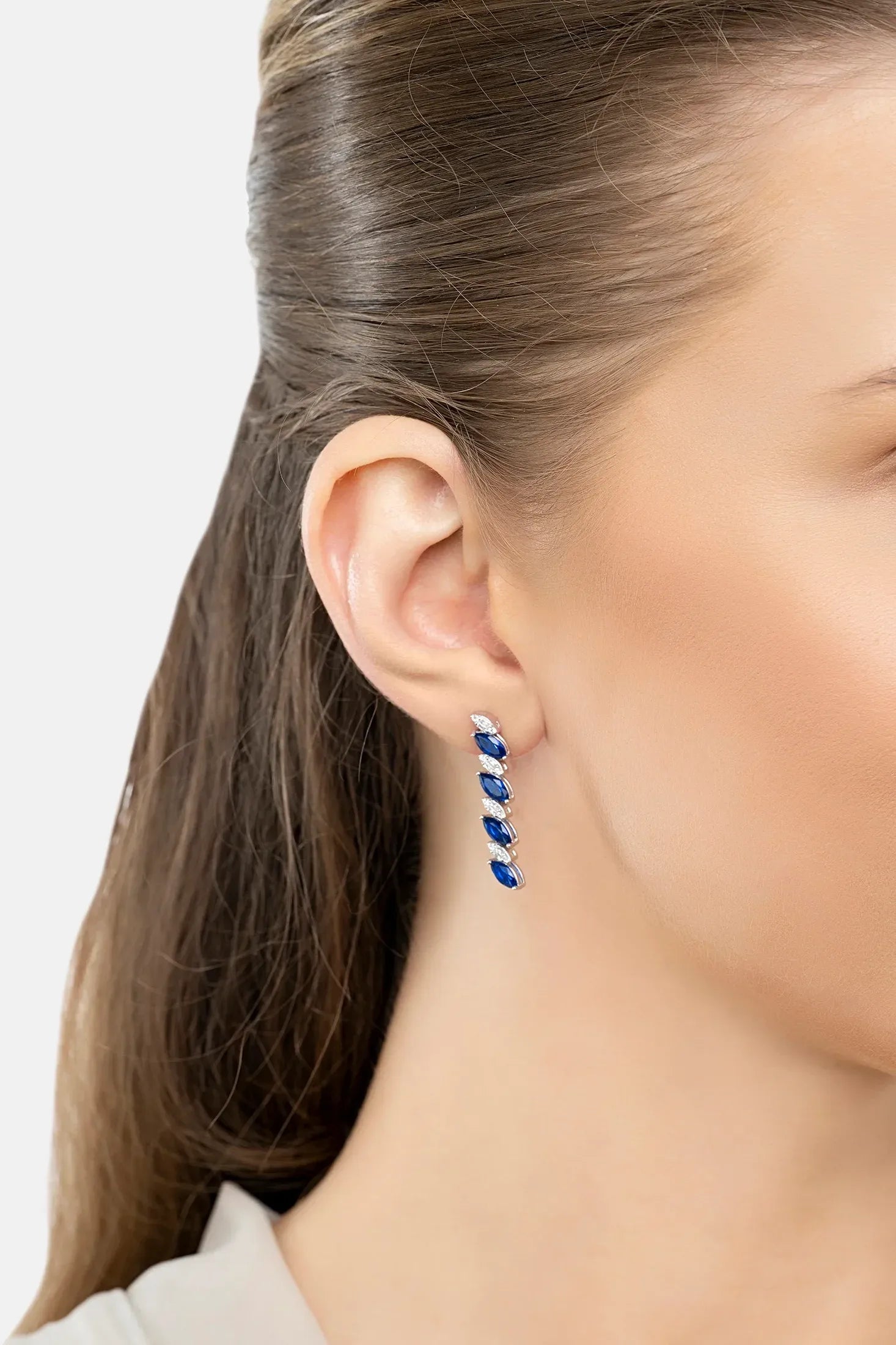 The earring worn by a model.