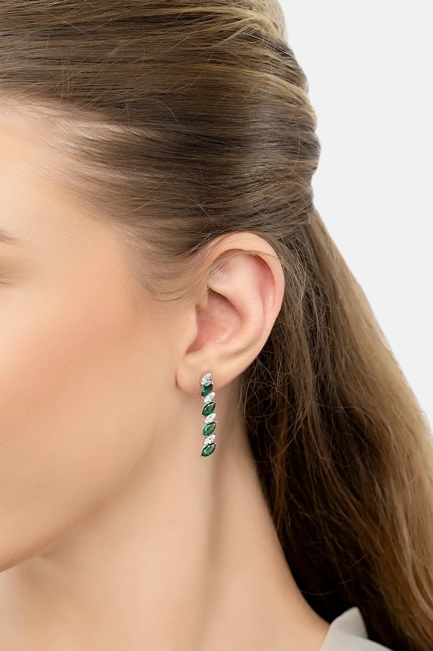 The earring worn by a model.