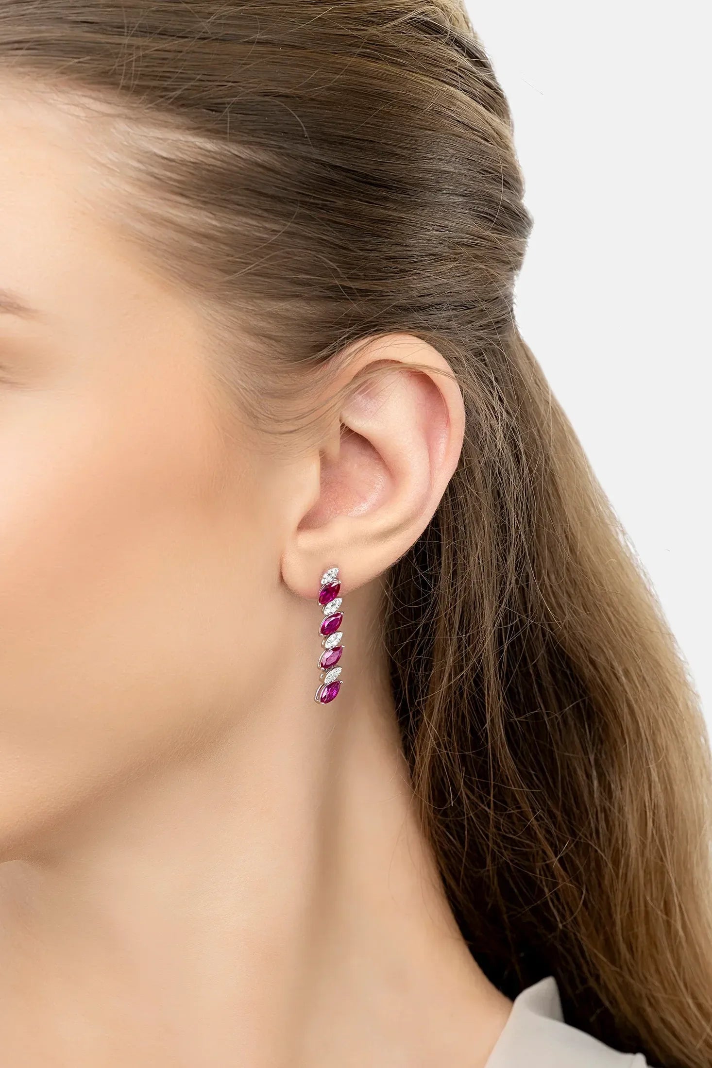 The earring worn by a model.